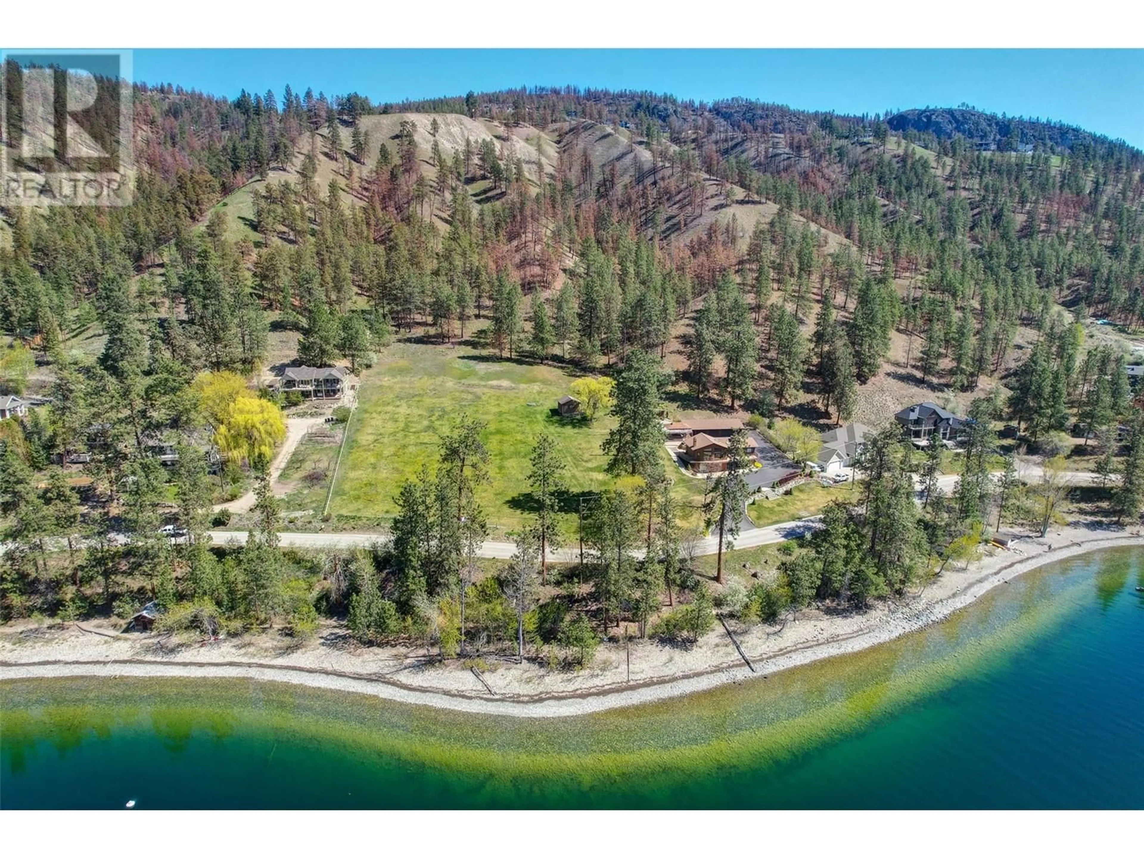 A pic from outside/outdoor area/front of a property/back of a property/a pic from drone, water/lake/river/ocean view for 9983 OKANAGAN CENTRE ROAD WEST, Lake Country British Columbia V4V2J3
