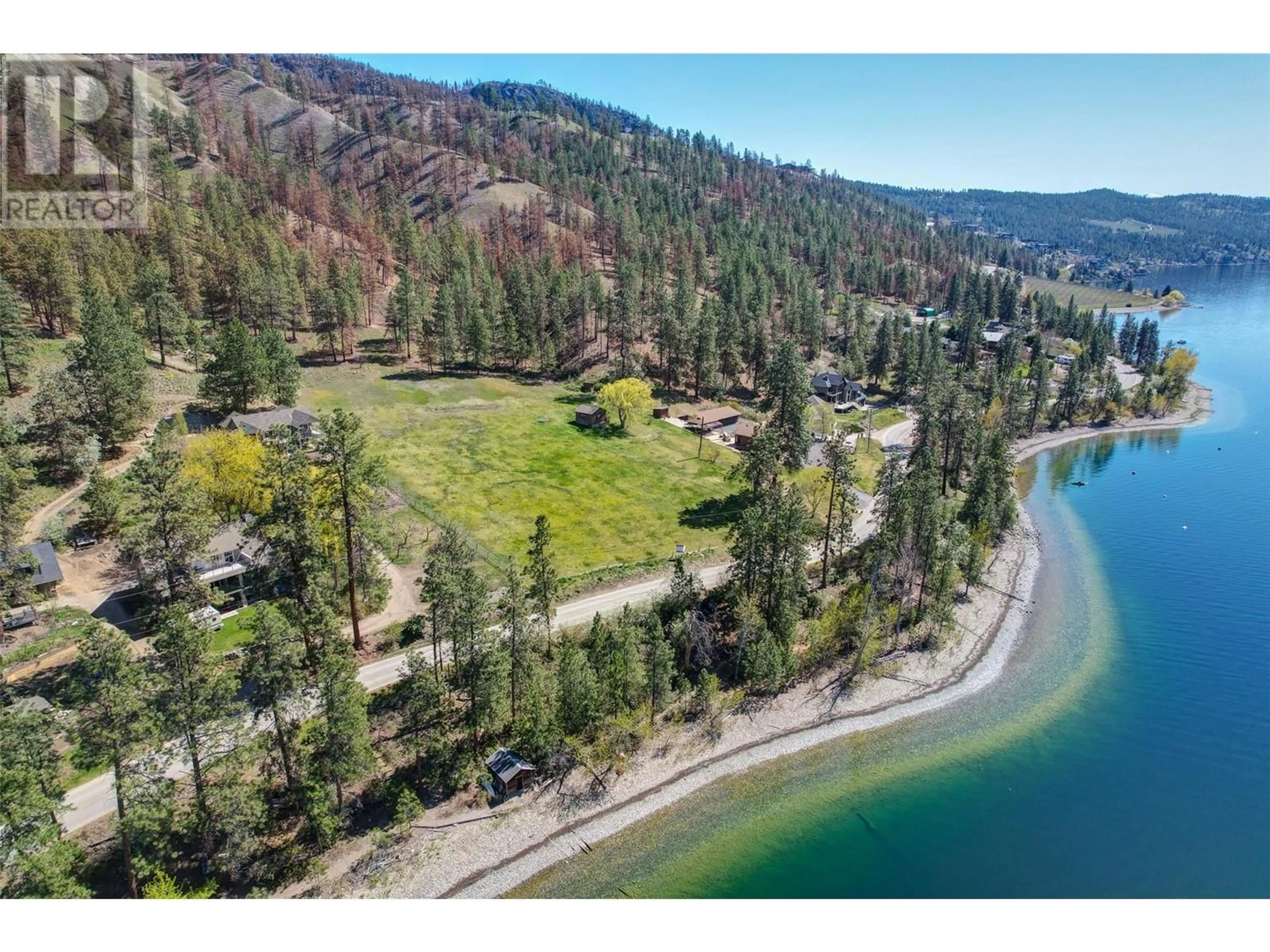A pic from outside/outdoor area/front of a property/back of a property/a pic from drone, water/lake/river/ocean view for 9983 OKANAGAN CENTRE ROAD WEST, Lake Country British Columbia V4V2J3