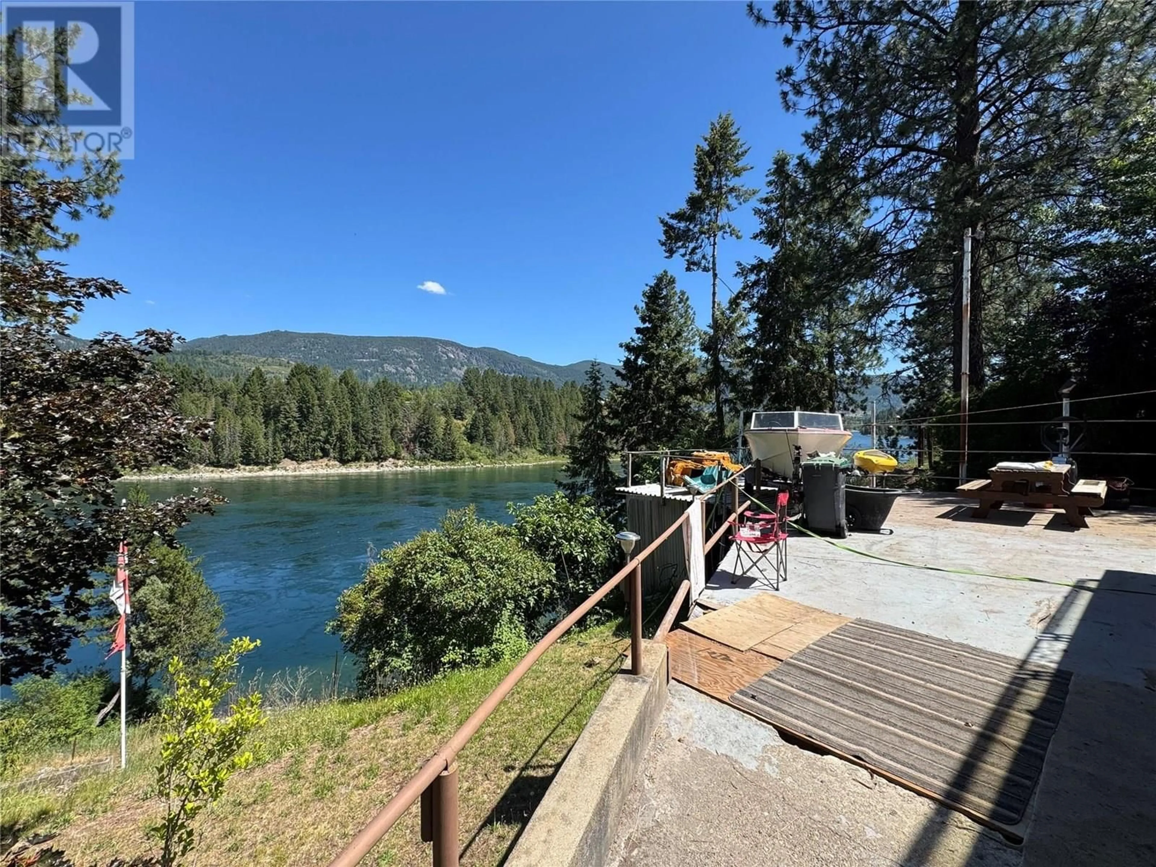 A pic from outside/outdoor area/front of a property/back of a property/a pic from drone, water/lake/river/ocean view for 604 11TH STREET, Castlegar British Columbia V1N2J9