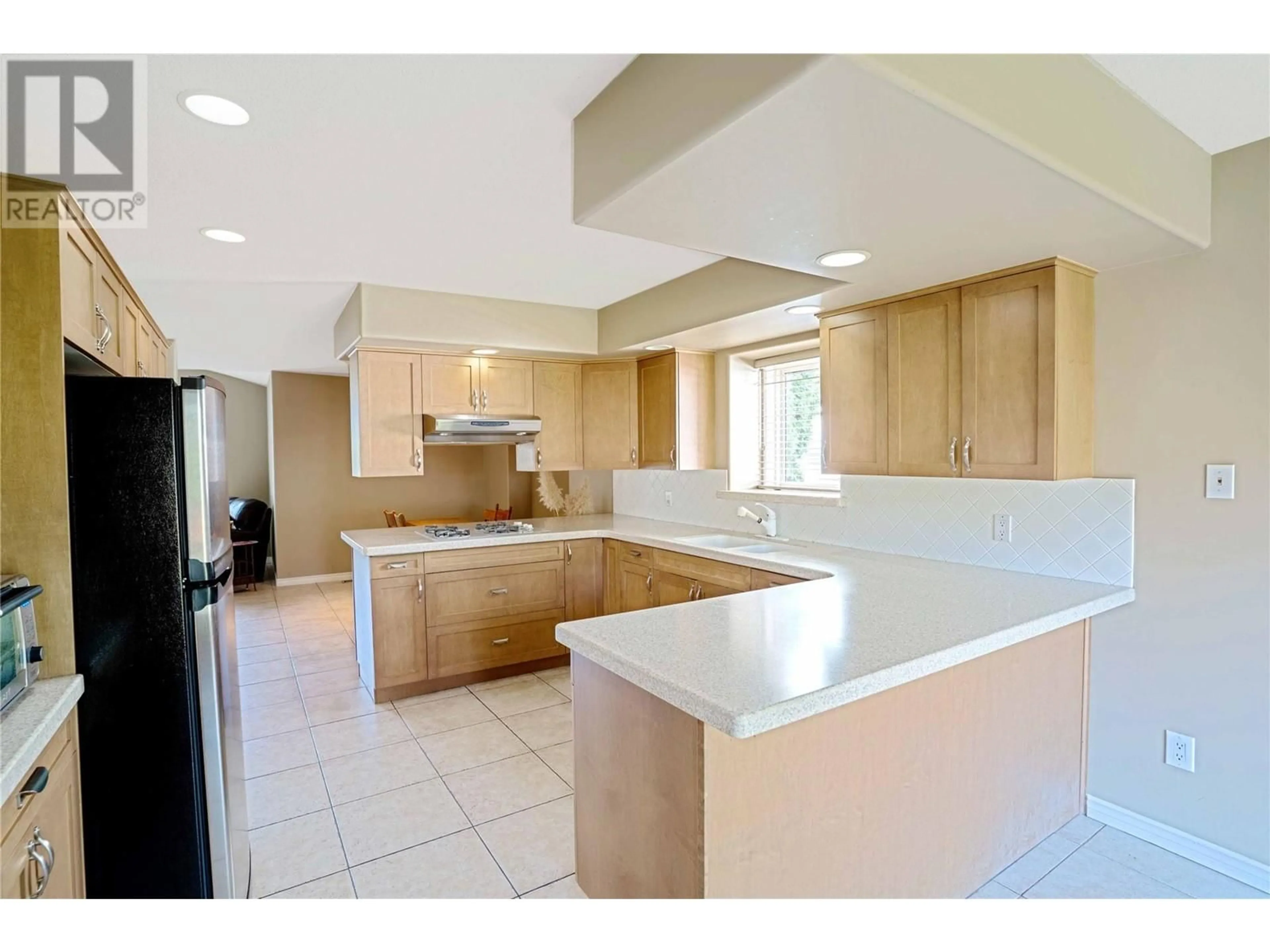 Open concept kitchen, ceramic/tile floor for 826 BULLOCK ROAD, Kelowna British Columbia V1W2C1