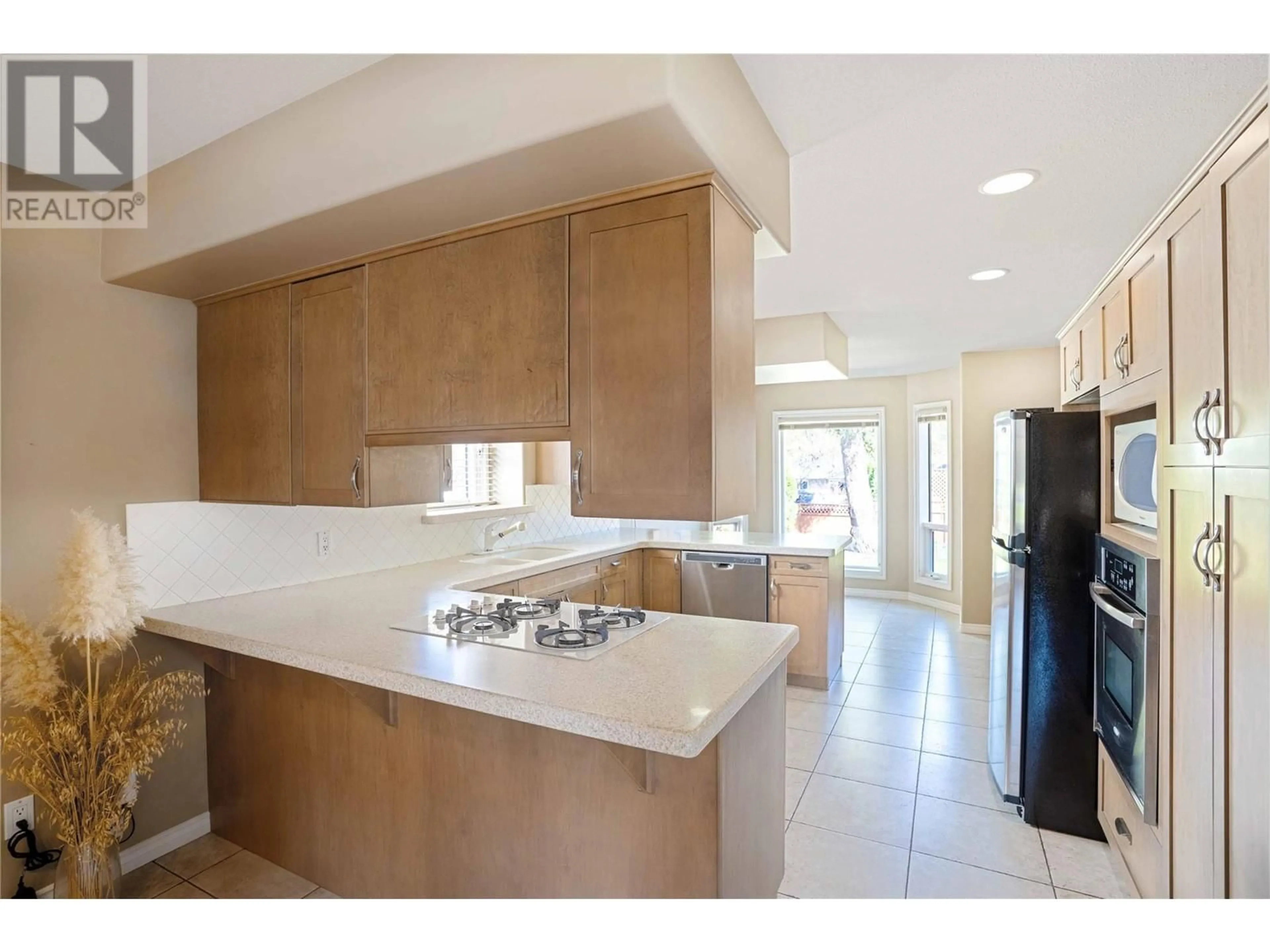 Open concept kitchen, ceramic/tile floor for 826 BULLOCK ROAD, Kelowna British Columbia V1W2C1