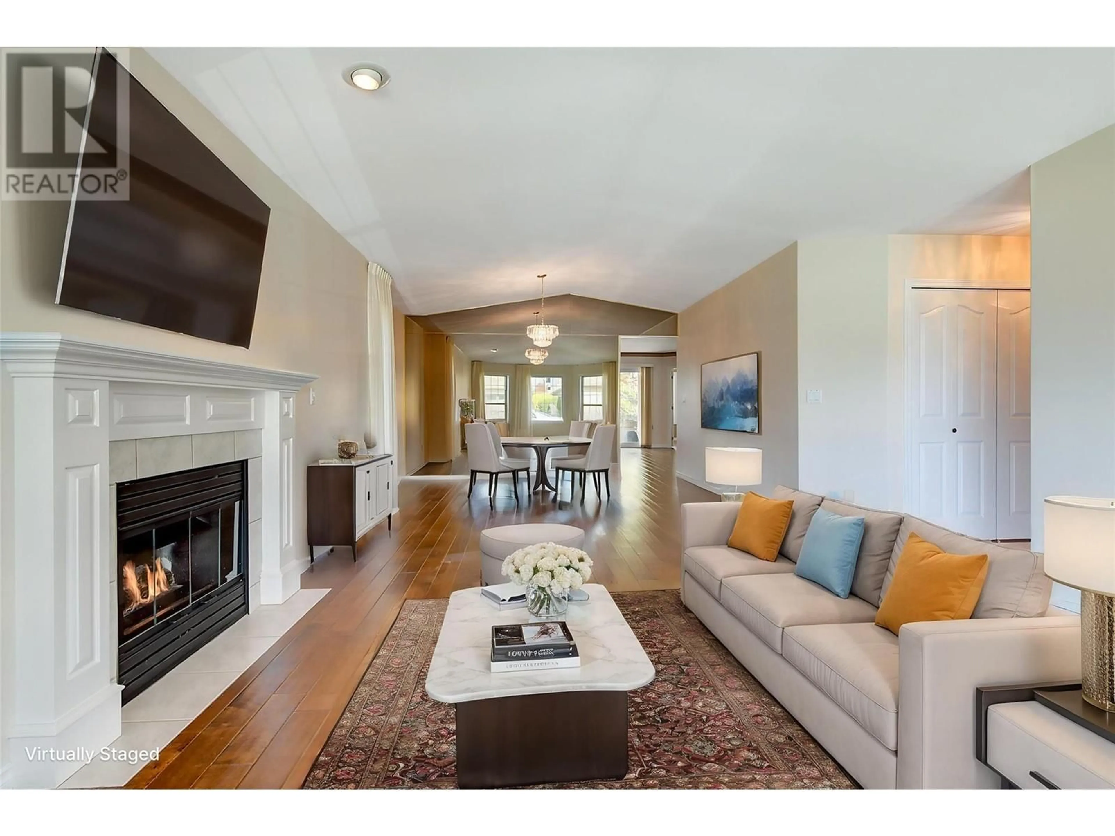 Living room with furniture, wood/laminate floor for 313 - 595 YATES ROAD, Kelowna British Columbia V1V1P8