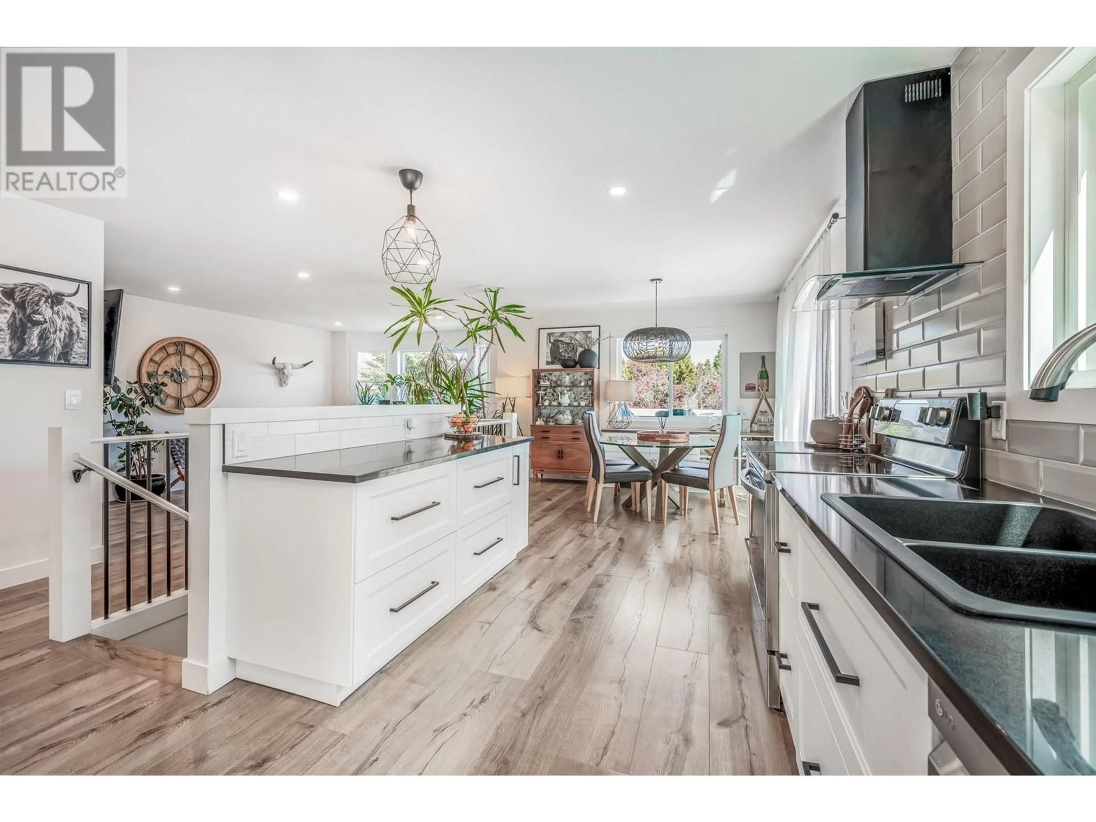 Open concept kitchen, wood/laminate floor for 1141 LYNDEN ROAD, West Kelowna British Columbia V1Z3L7