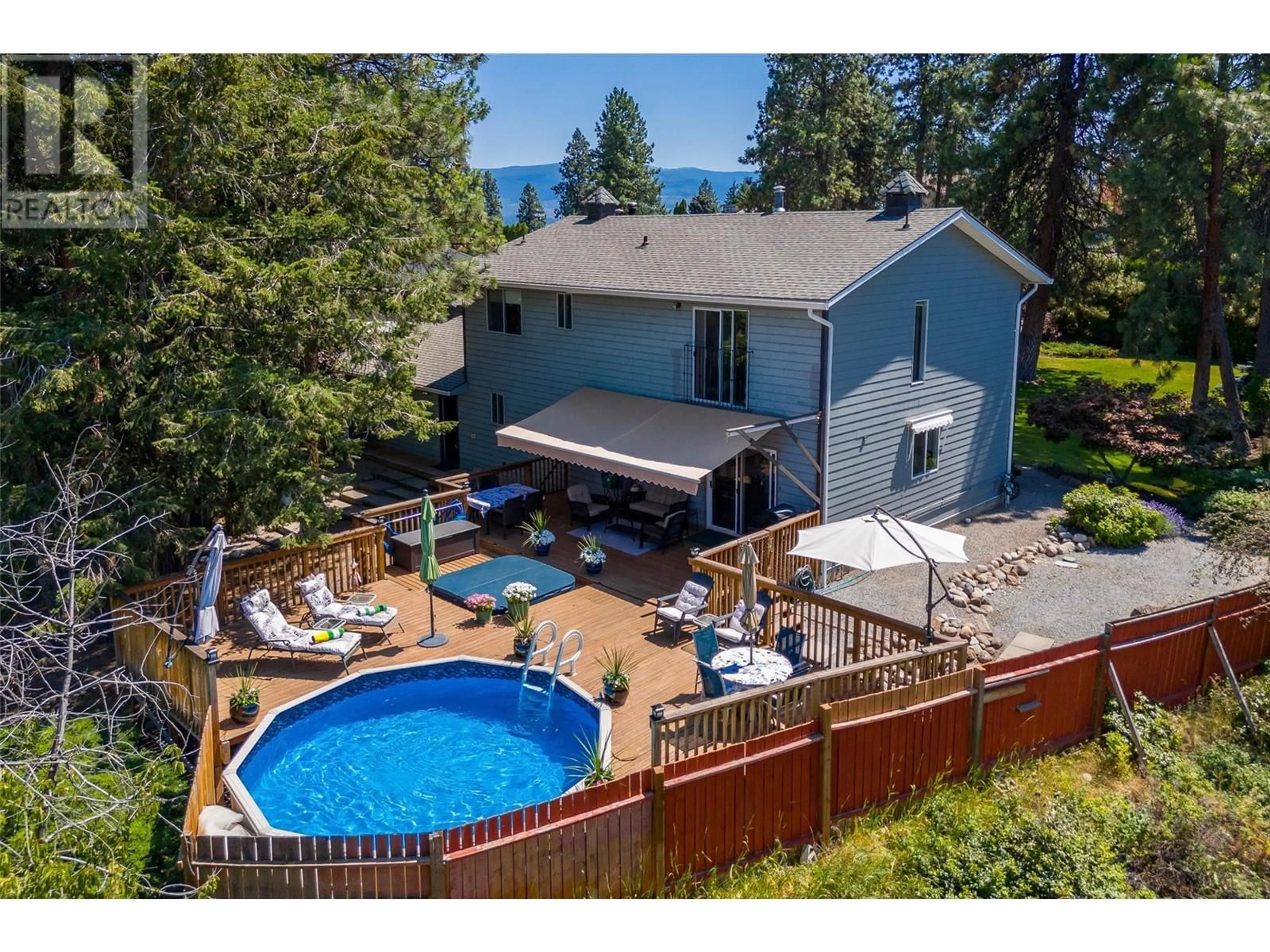 A pic from outside/outdoor area/front of a property/back of a property/a pic from drone, water/lake/river/ocean view for 1996 TOMAT AVENUE, Kelowna British Columbia V1Z3C5