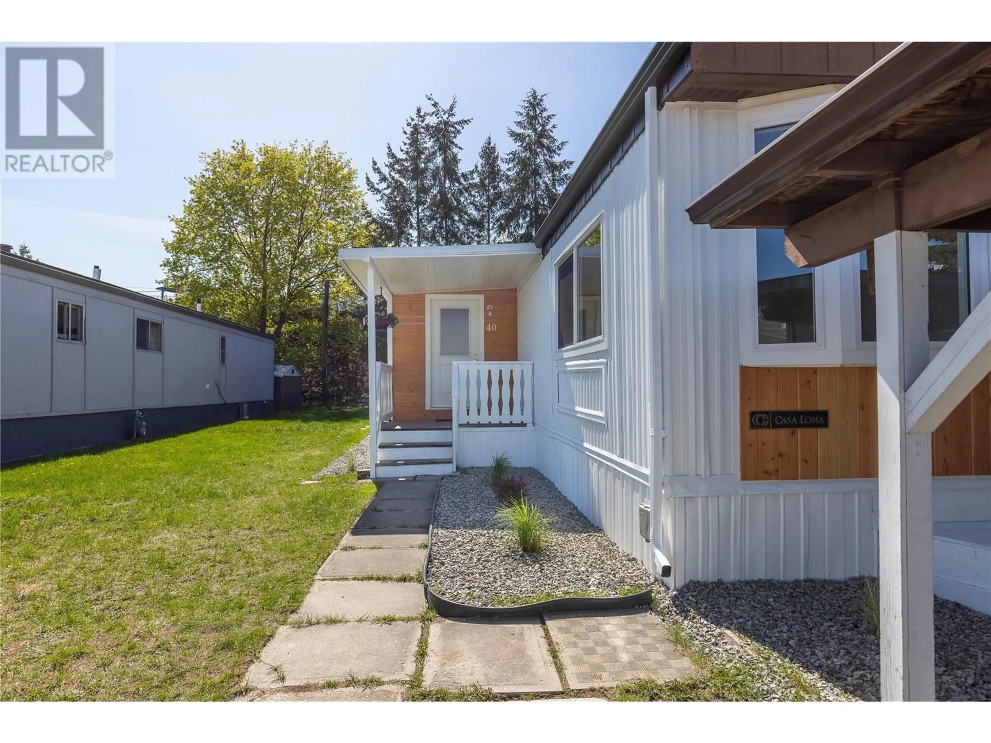 Home with vinyl exterior material, street for 40 - 6902 OKANAGAN LANDING ROAD, Vernon British Columbia V1H1X4