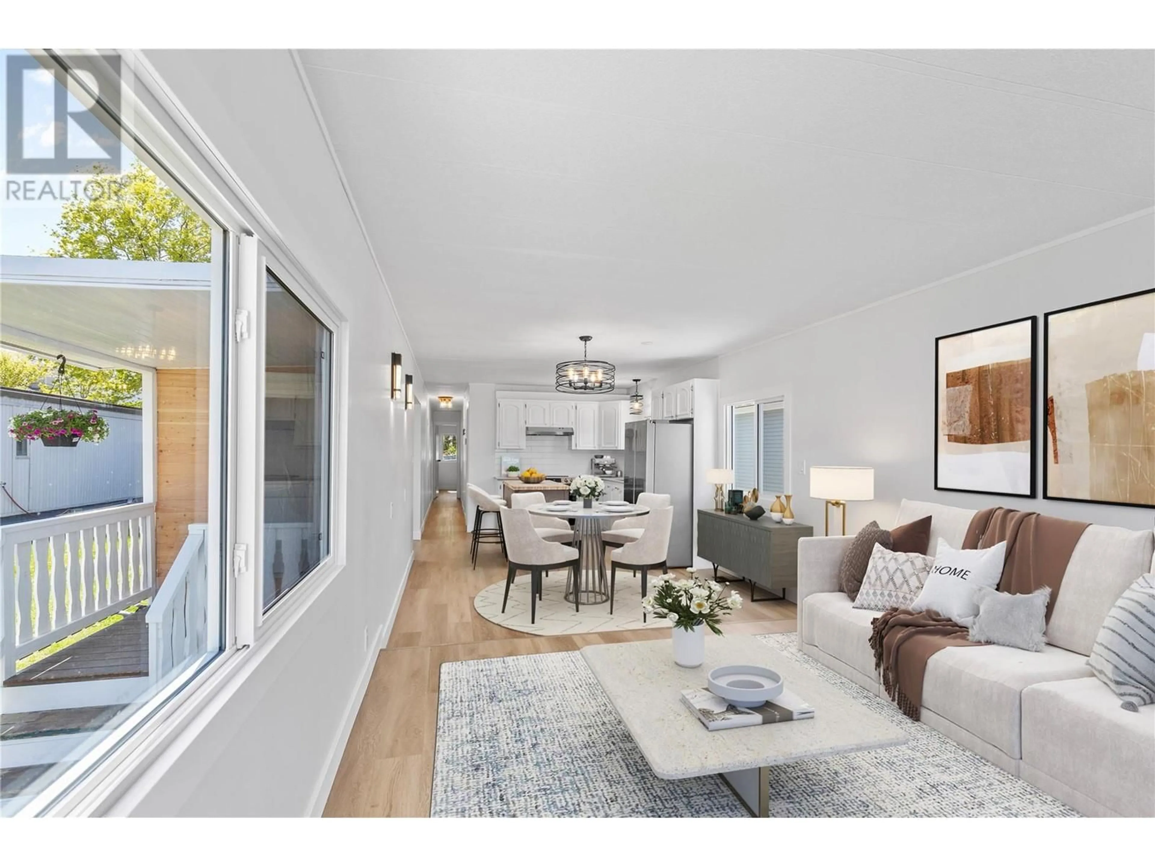 Living room with furniture, wood/laminate floor for 40 - 6902 OKANAGAN LANDING ROAD, Vernon British Columbia V1H1X4