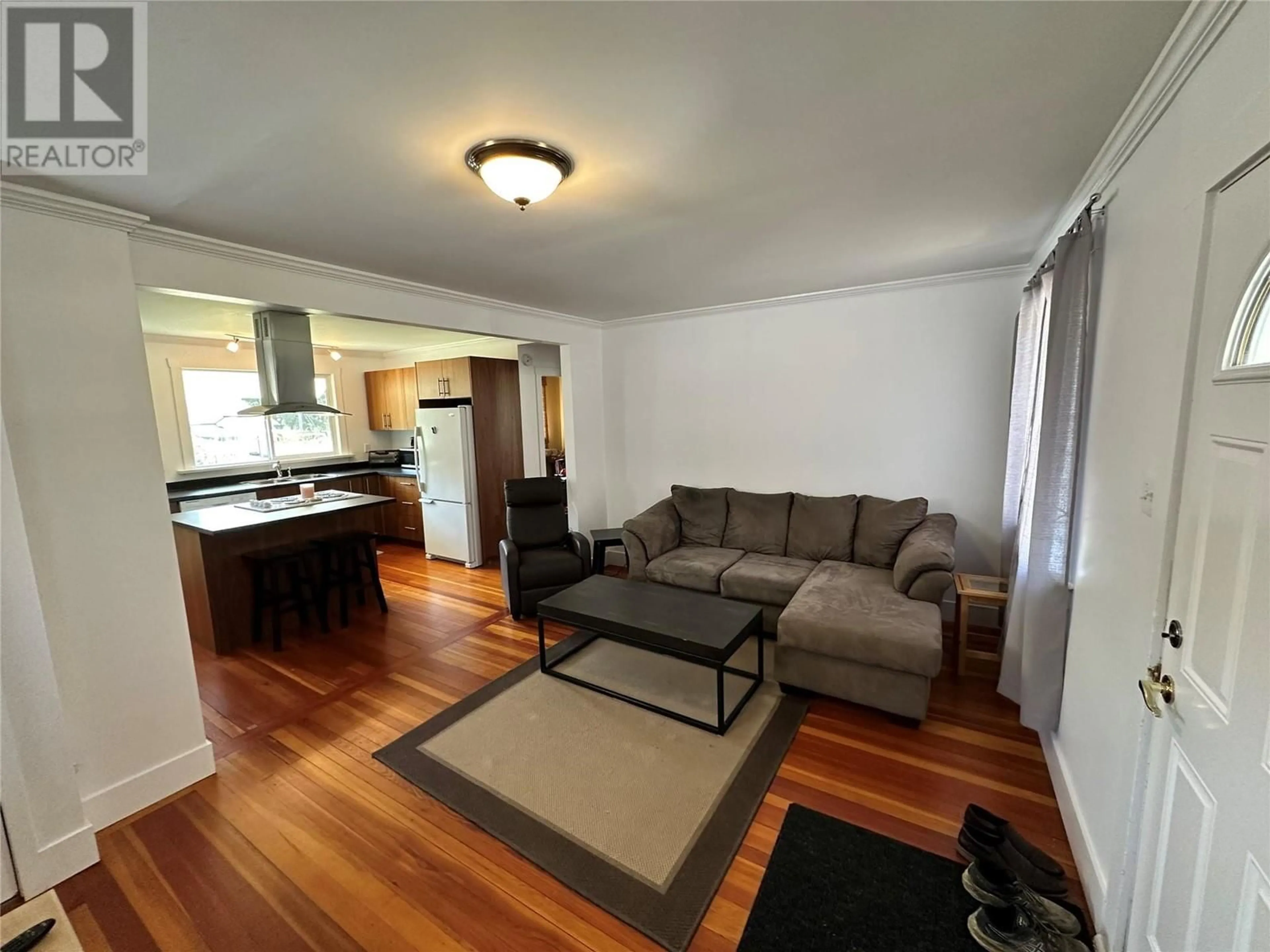 Living room with furniture, wood/laminate floor for 2264 EIGHTH AVENUE, Trail British Columbia V1R3E3