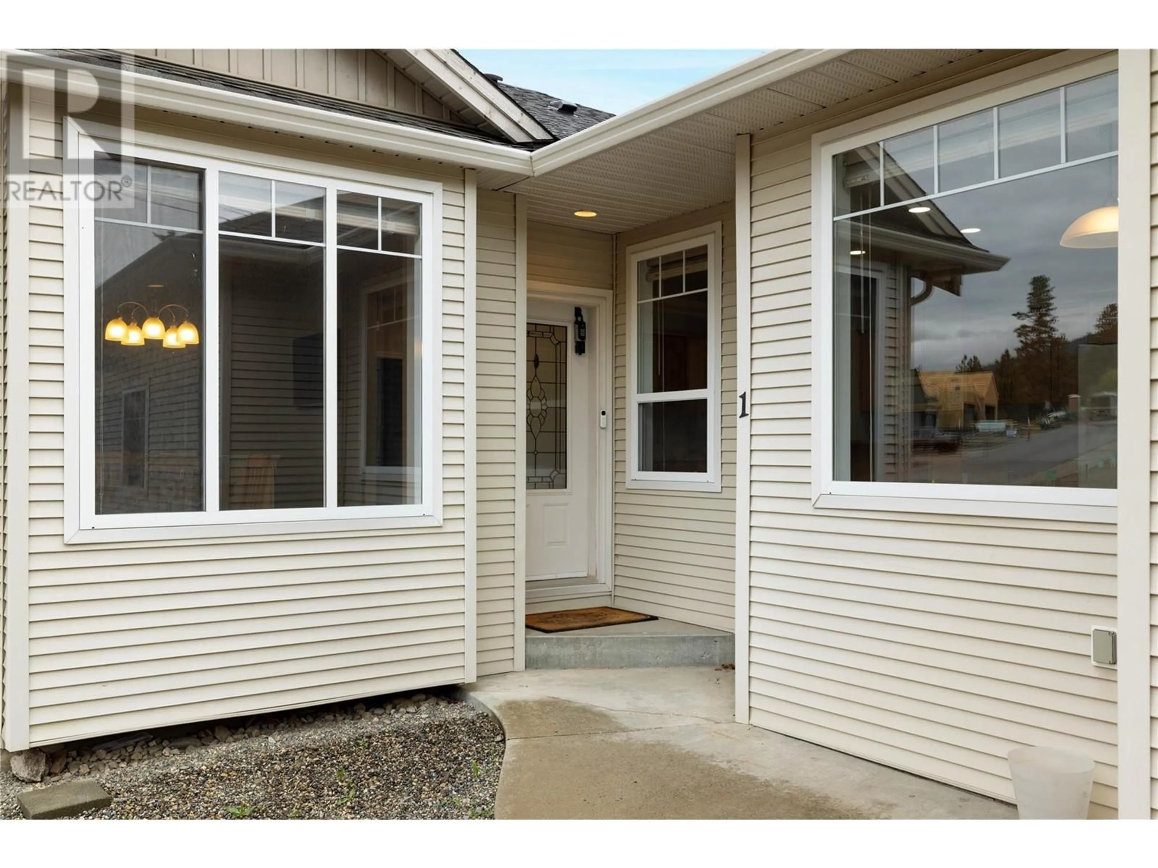 Home with vinyl exterior material, street for 1 - 6957 MANNING PLACE, Vernon British Columbia V1B2Y6