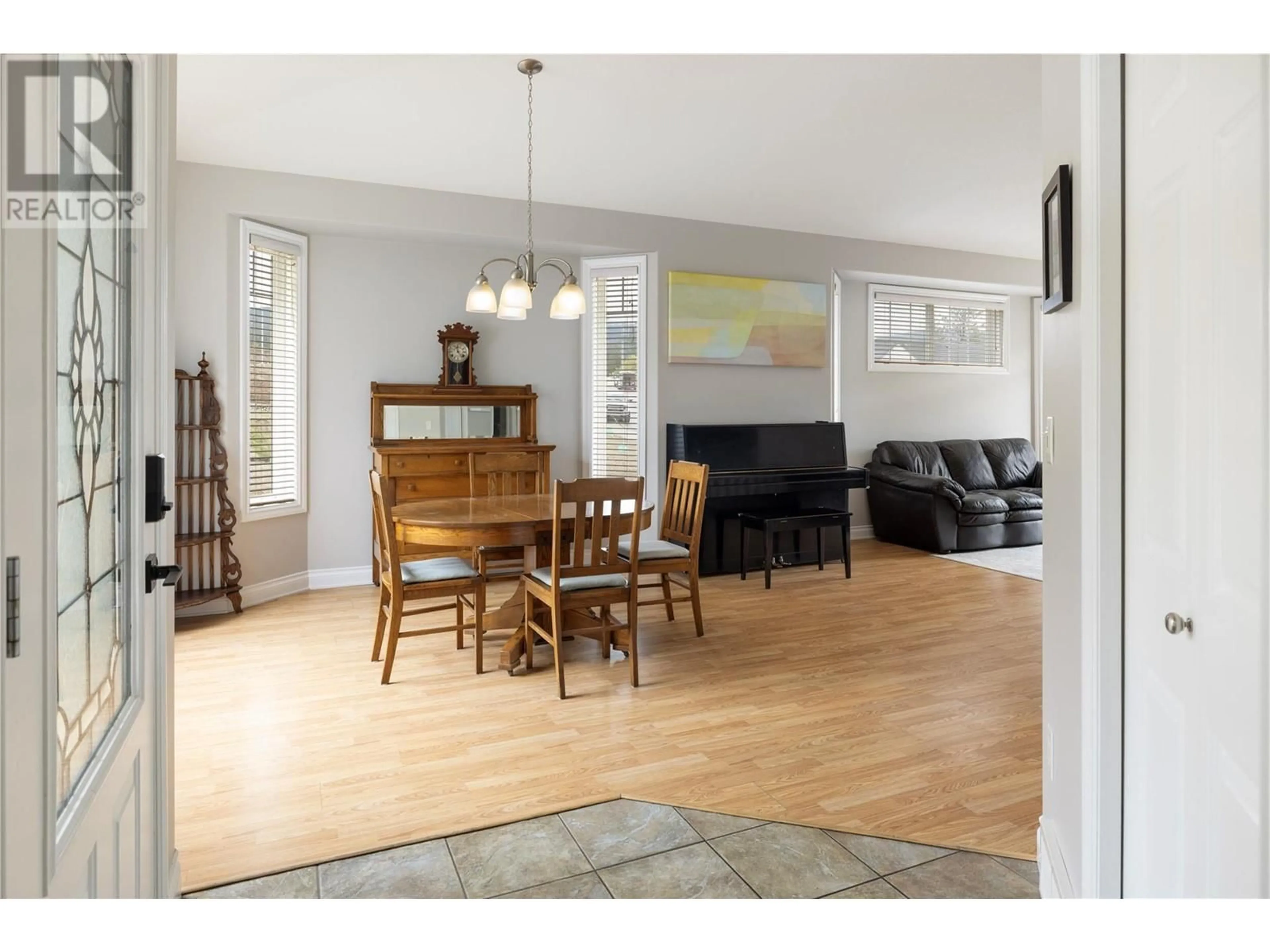 Living room with furniture, wood/laminate floor for 1 - 6957 MANNING PLACE, Vernon British Columbia V1B2Y6