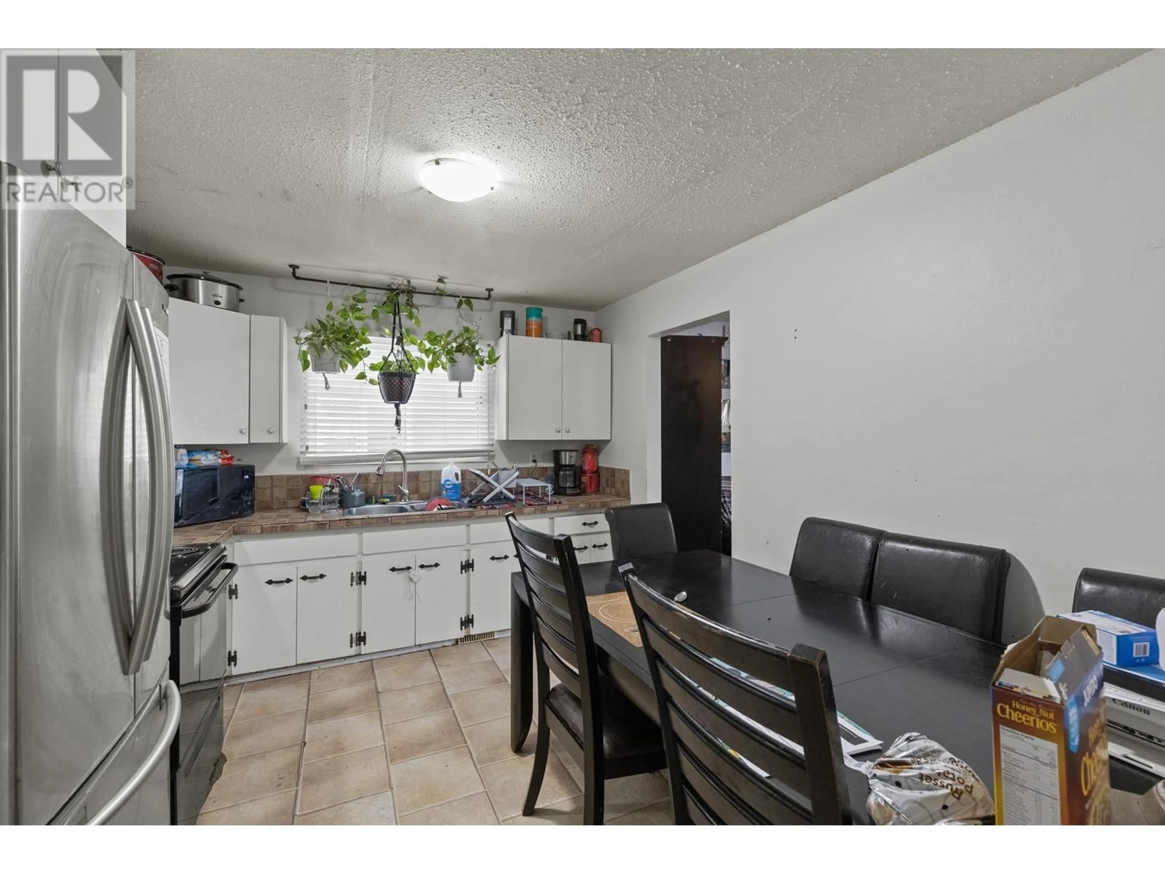 Standard kitchen, ceramic/tile floor for 490D HEIN ROAD, Kelowna British Columbia V1X4A3
