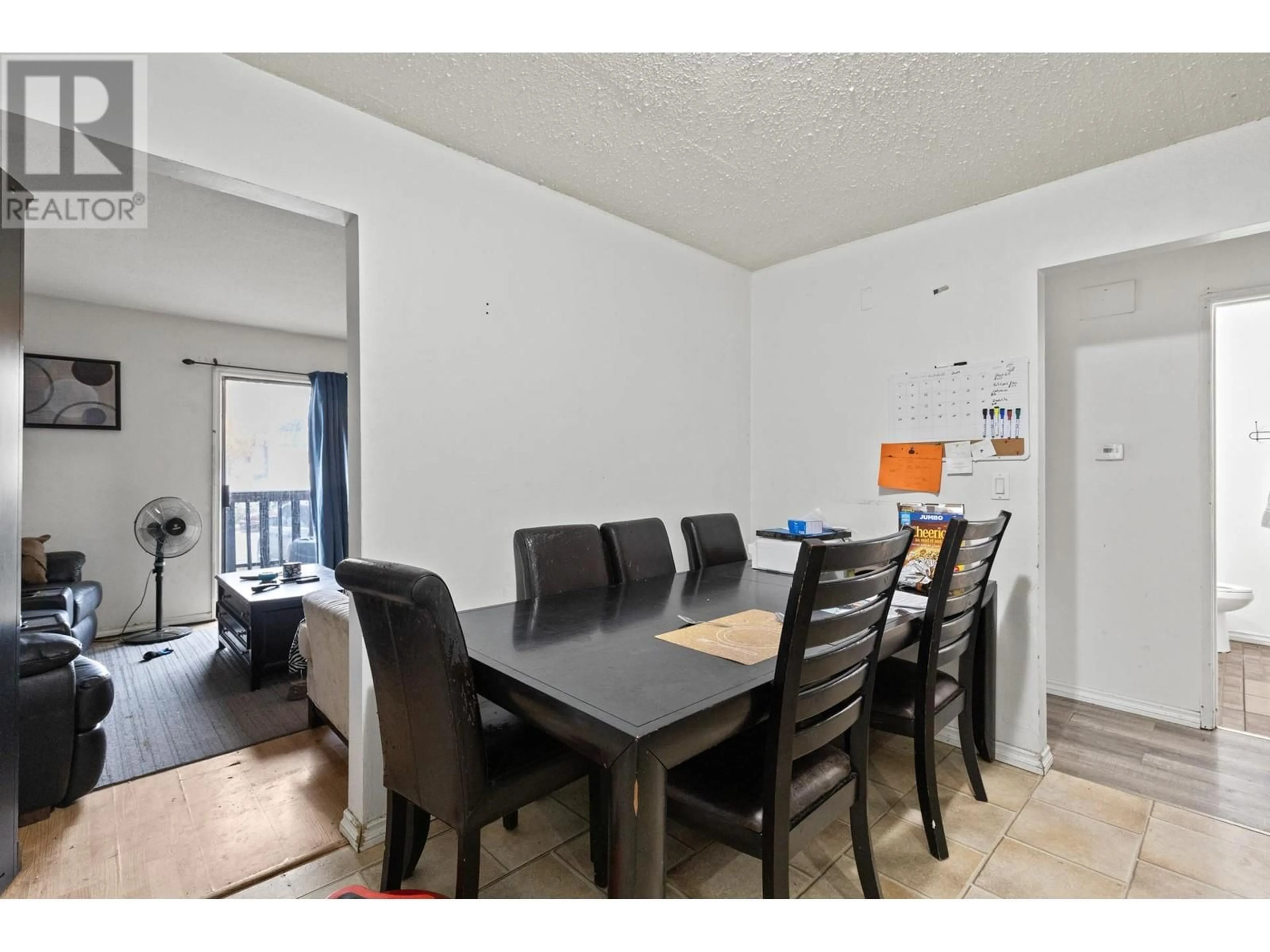 Dining room, wood/laminate floor for 490D HEIN ROAD, Kelowna British Columbia V1X4A3