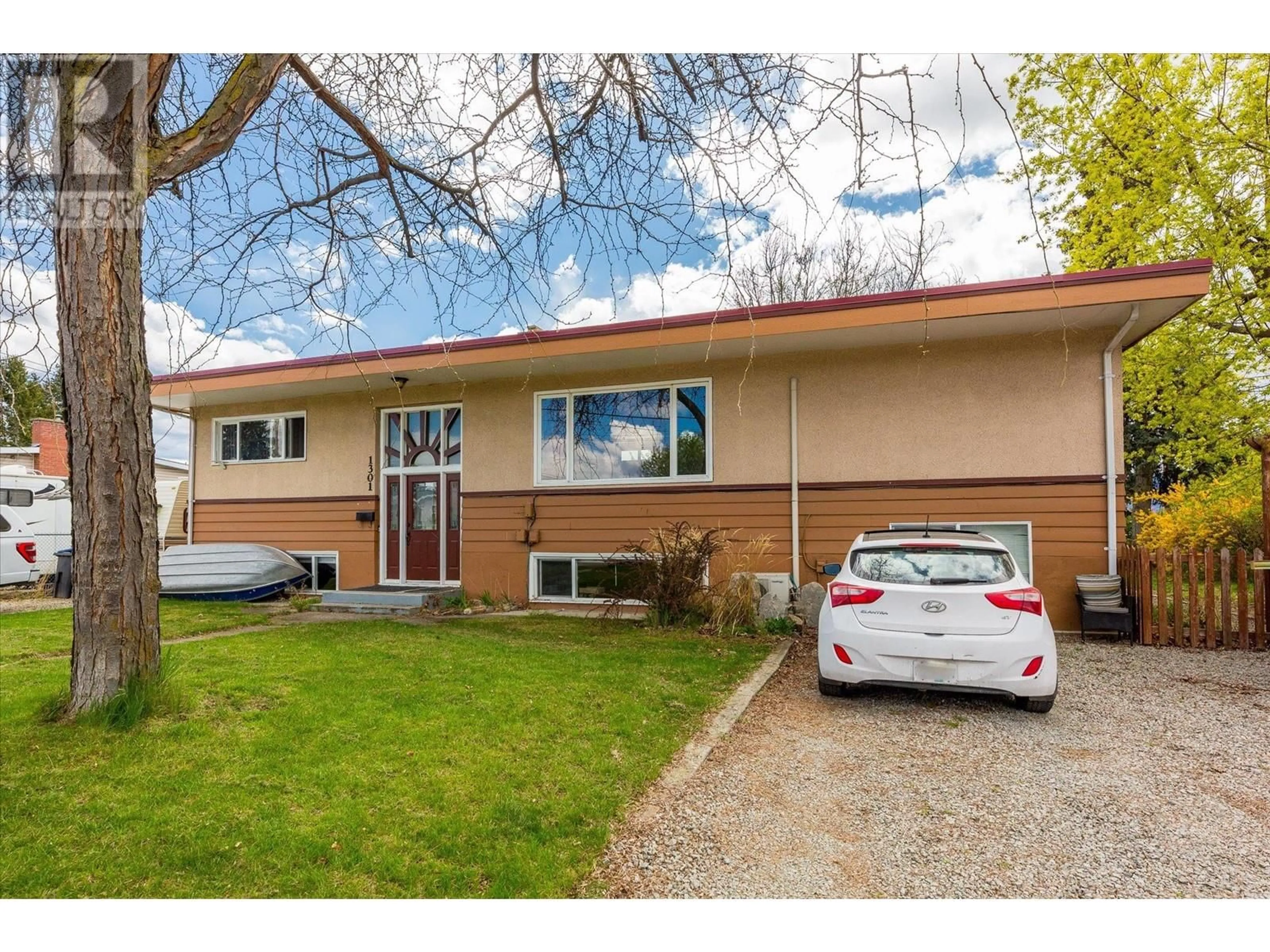 Home with brick exterior material, street for 1301 MCBRIDE ROAD, Kelowna British Columbia V1Y4A5