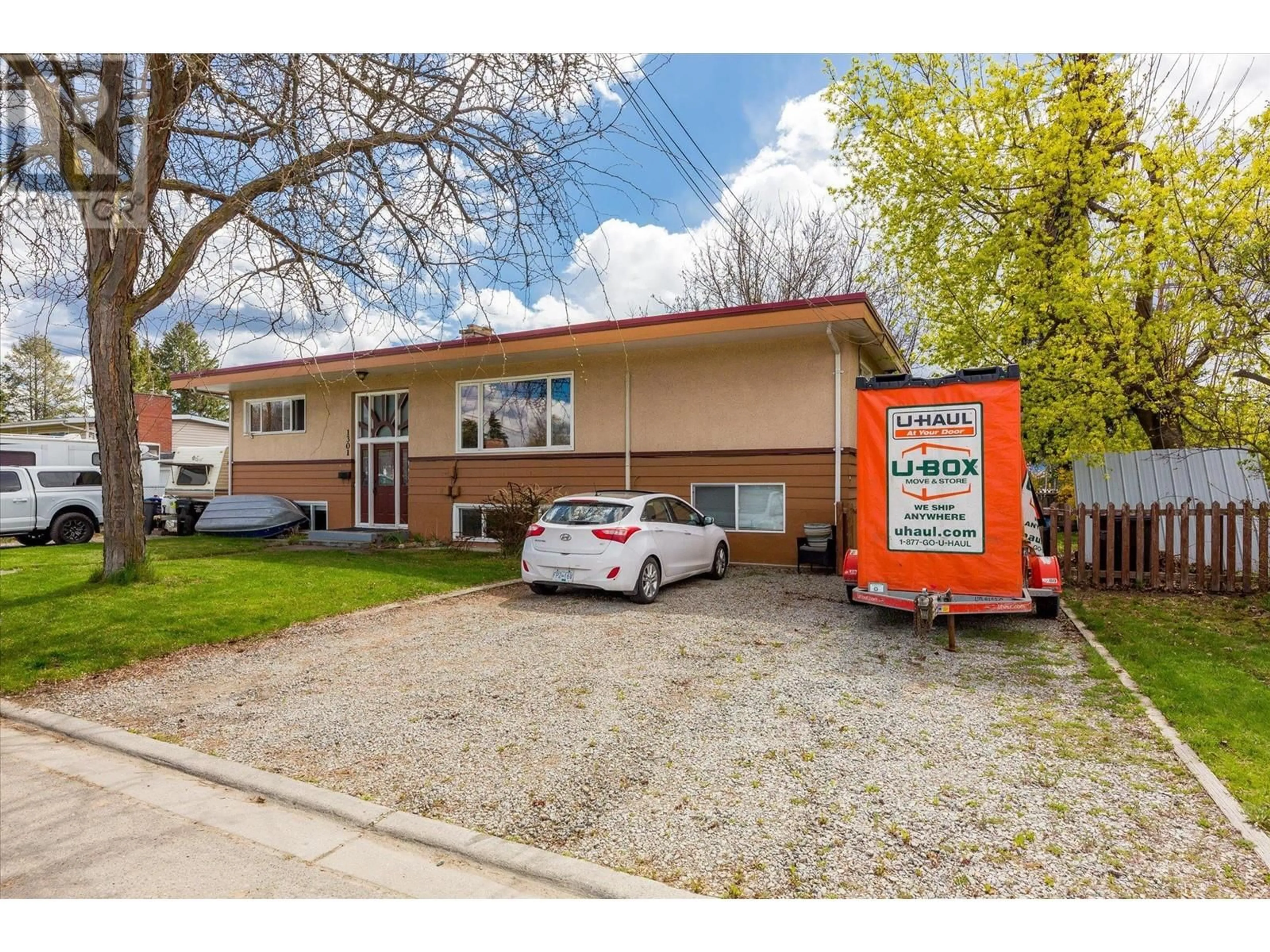 Home with vinyl exterior material, street for 1301 MCBRIDE ROAD, Kelowna British Columbia V1Y4A5