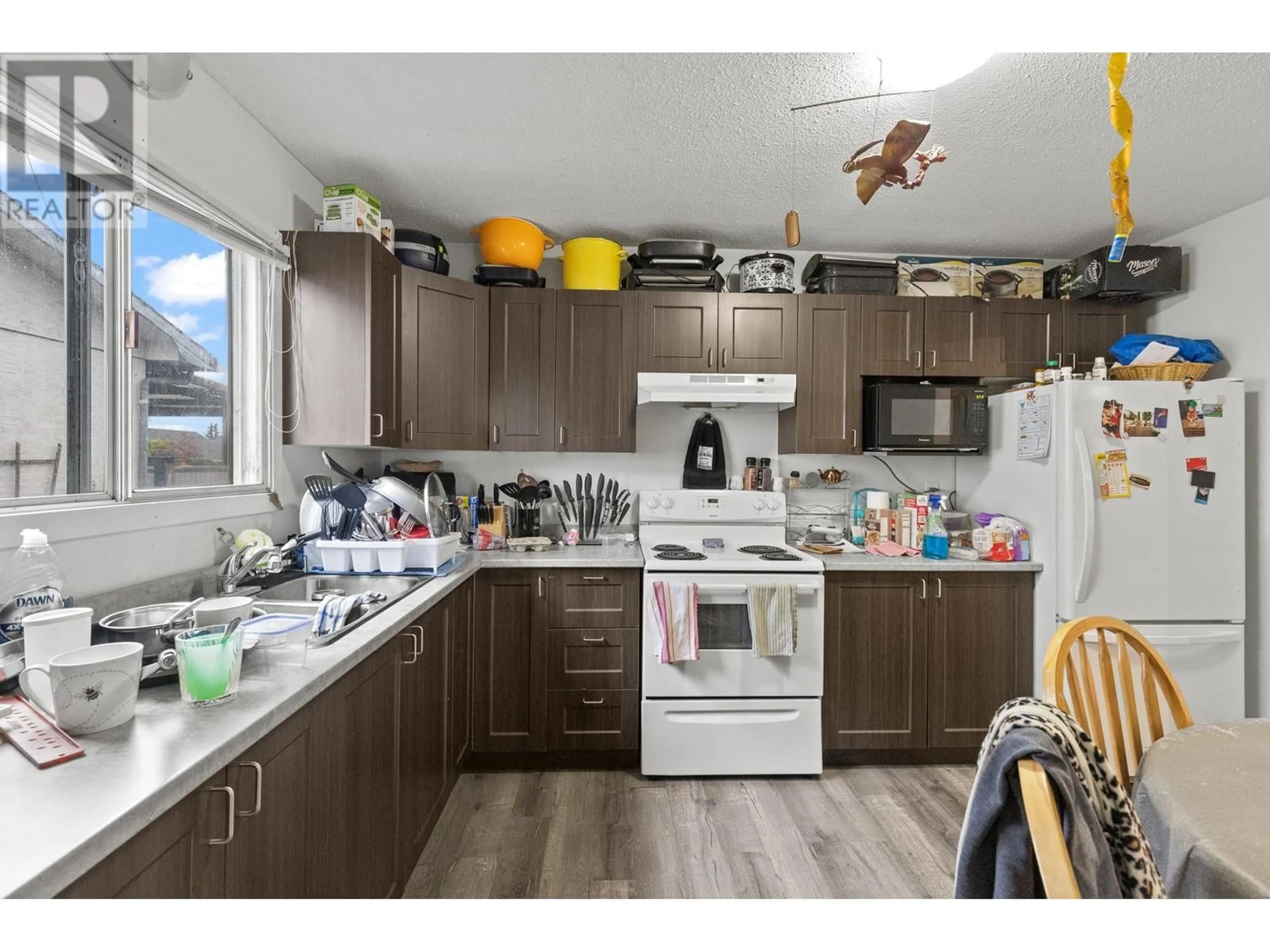 Standard kitchen, wood/laminate floor for 490A HEIN ROAD, Kelowna British Columbia V1X4A3