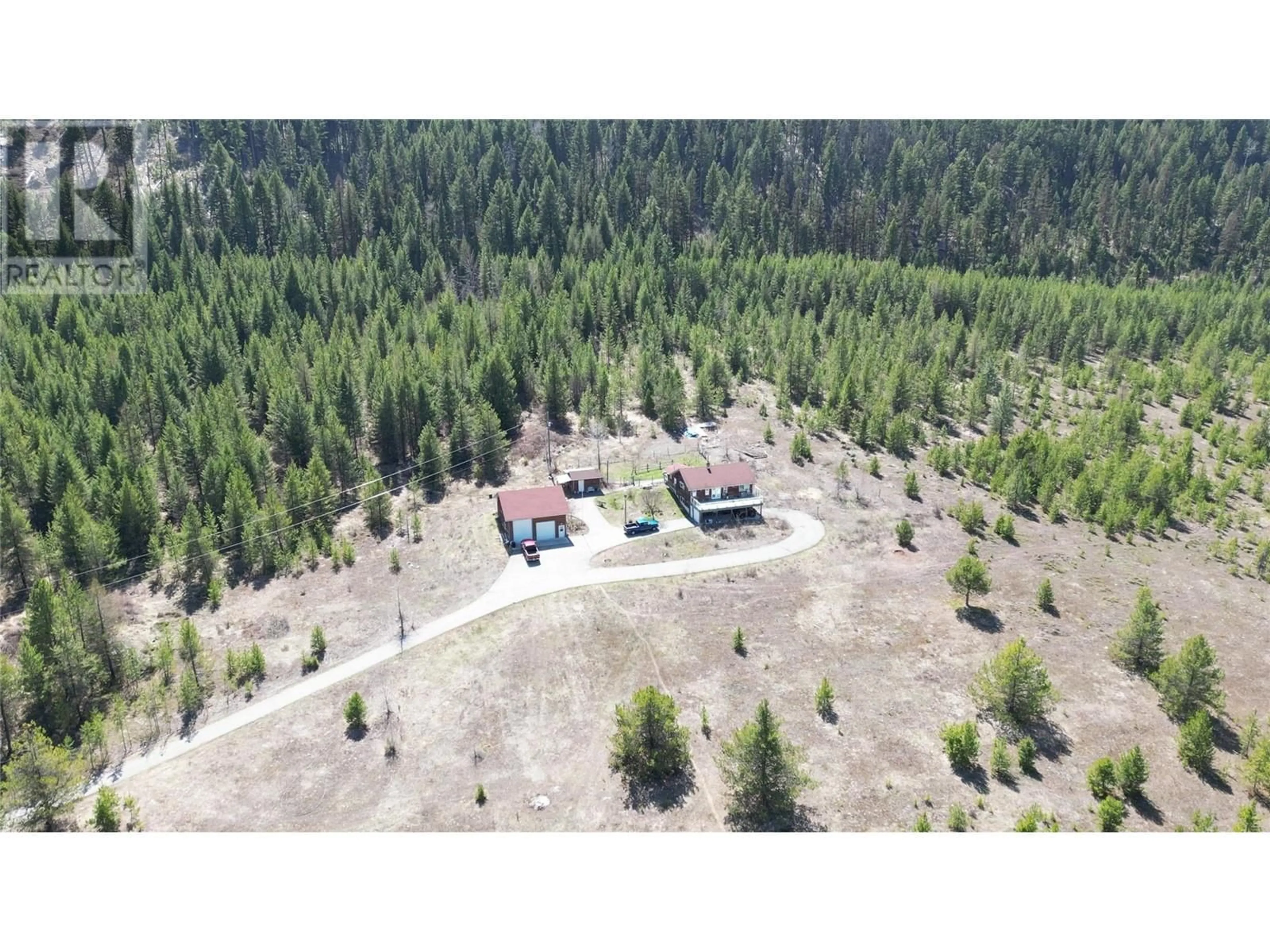 A pic from outside/outdoor area/front of a property/back of a property/a pic from drone, forest/trees view for 12155 HIGHWAY 3 HIGHWAY, Greenwood British Columbia V0H1J0