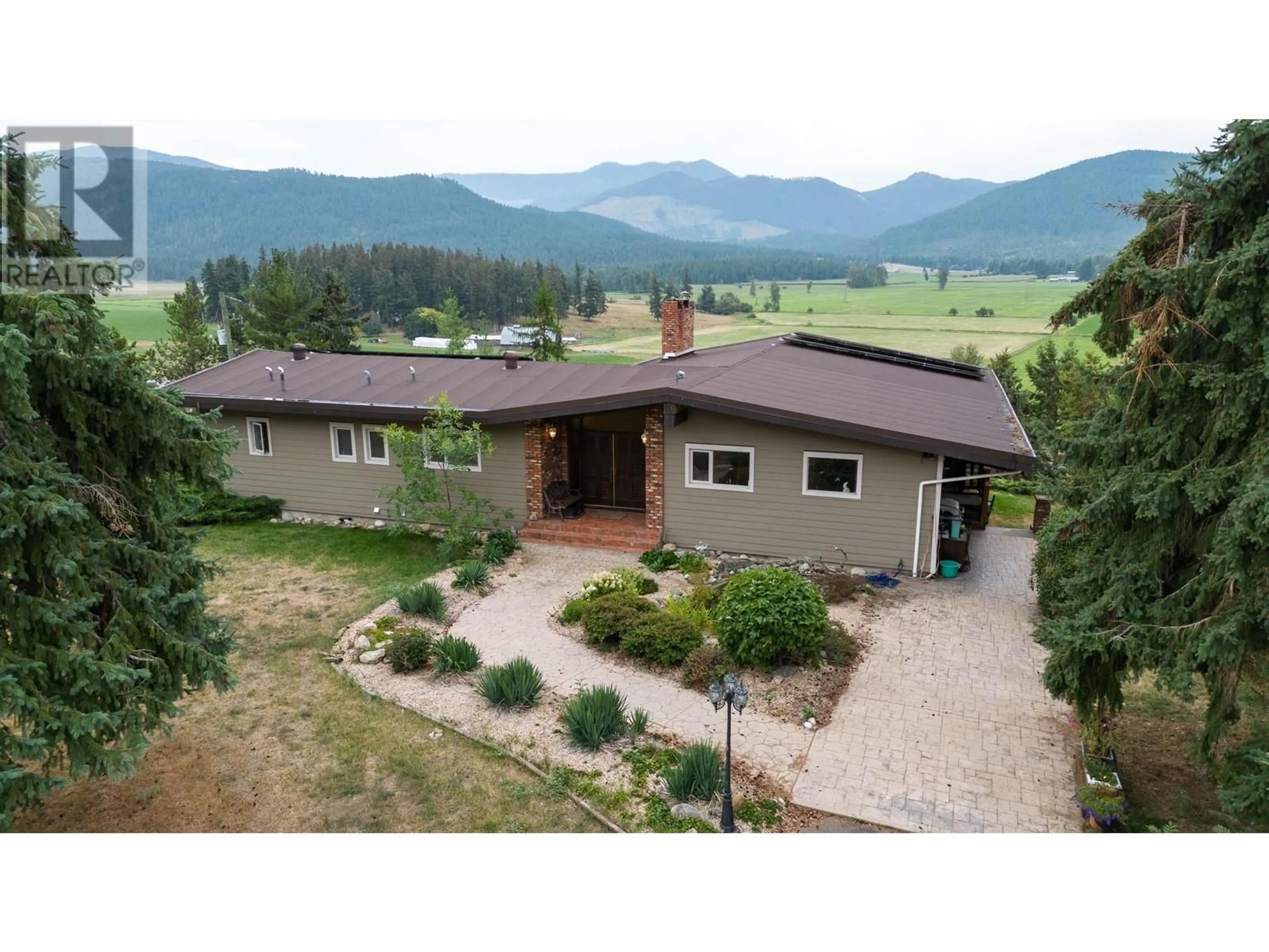 A pic from outside/outdoor area/front of a property/back of a property/a pic from drone, mountain view for 2545 6 HIGHWAY EAST, Lumby British Columbia V0E2G1