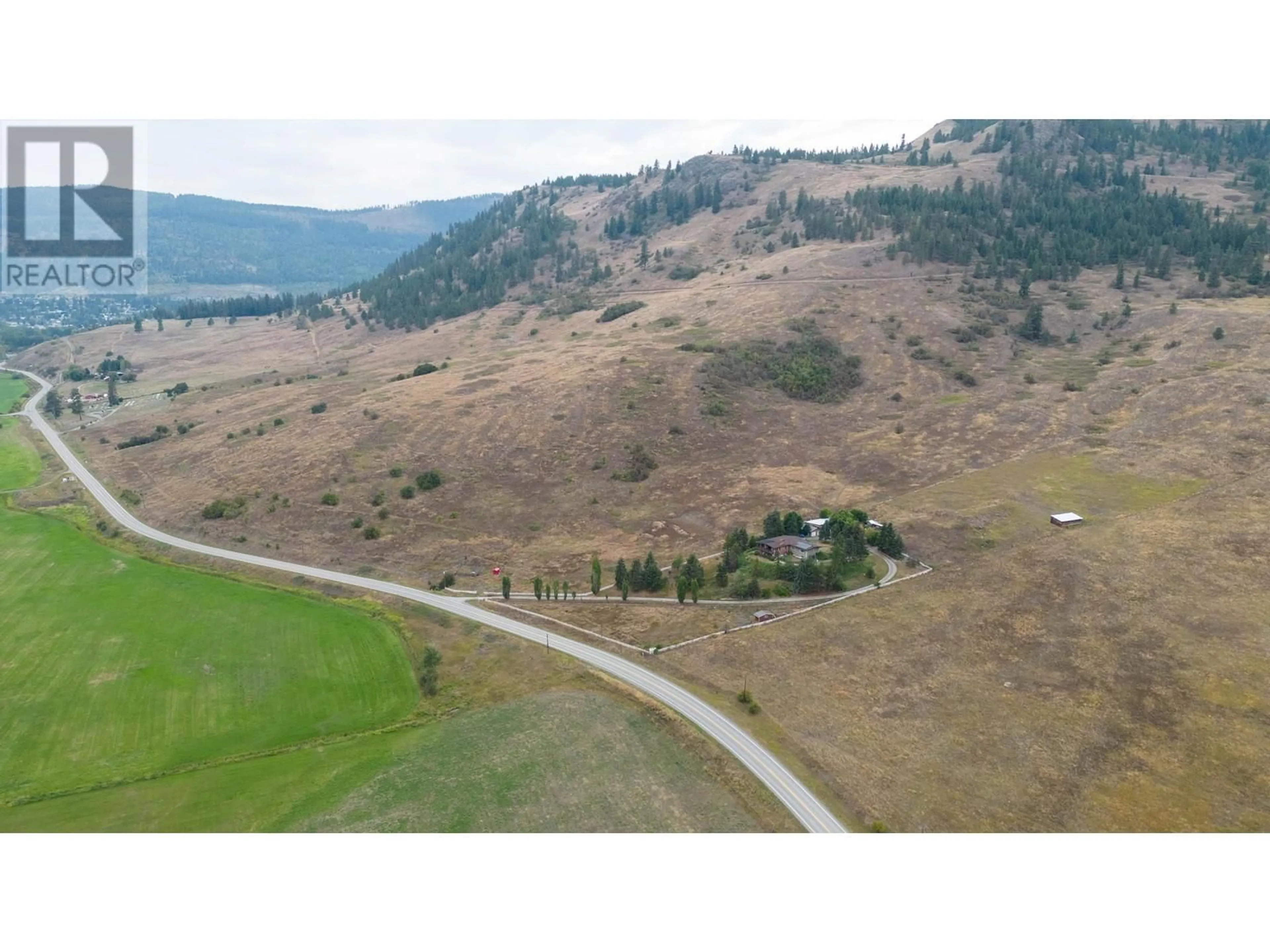 A pic from outside/outdoor area/front of a property/back of a property/a pic from drone, mountain view for 2545 6 HIGHWAY EAST, Lumby British Columbia V0E2G1