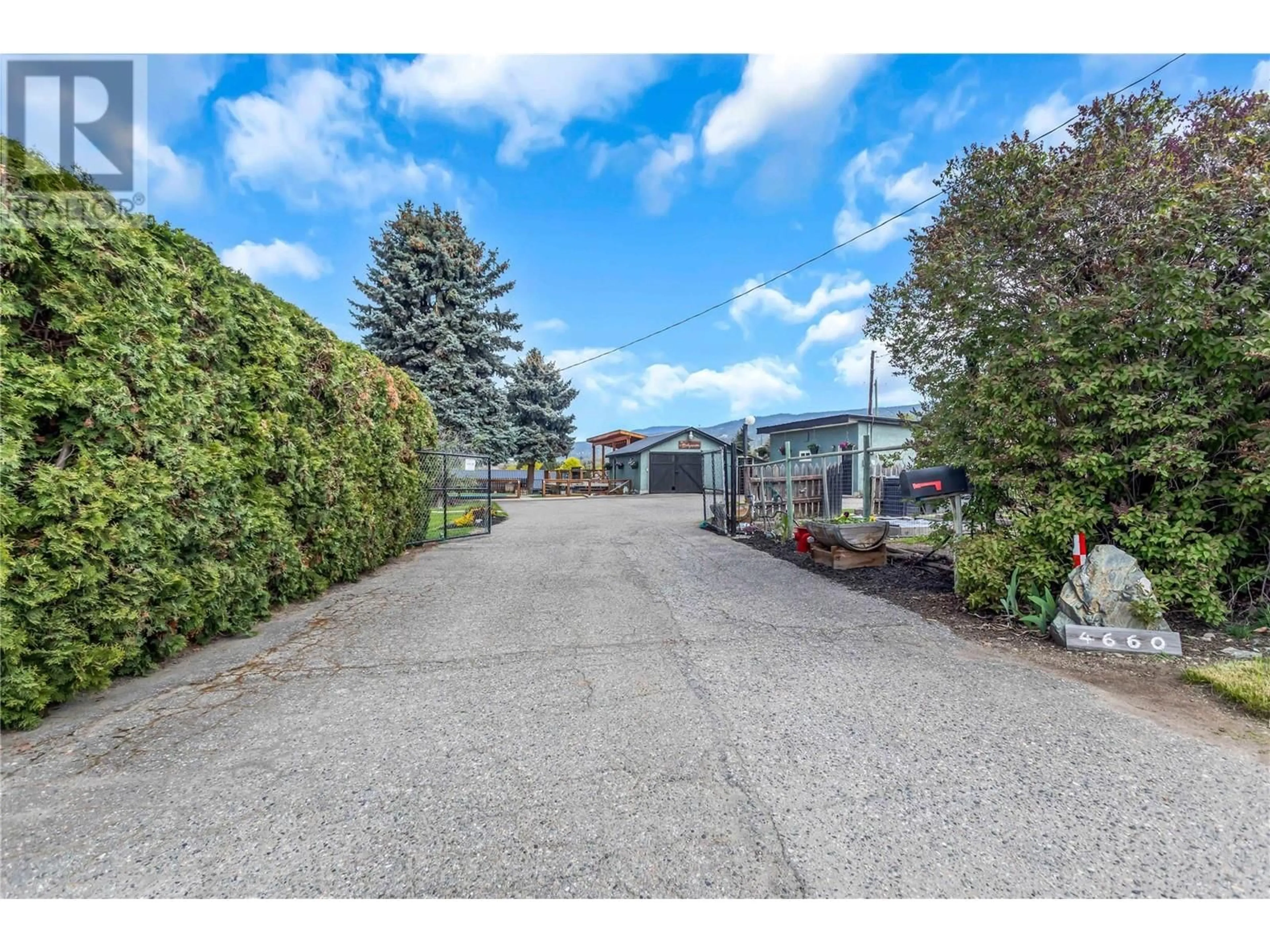 A pic from outside/outdoor area/front of a property/back of a property/a pic from drone, street for 4660 SCOTTY CREEK ROAD, Kelowna British Columbia V1X6N2