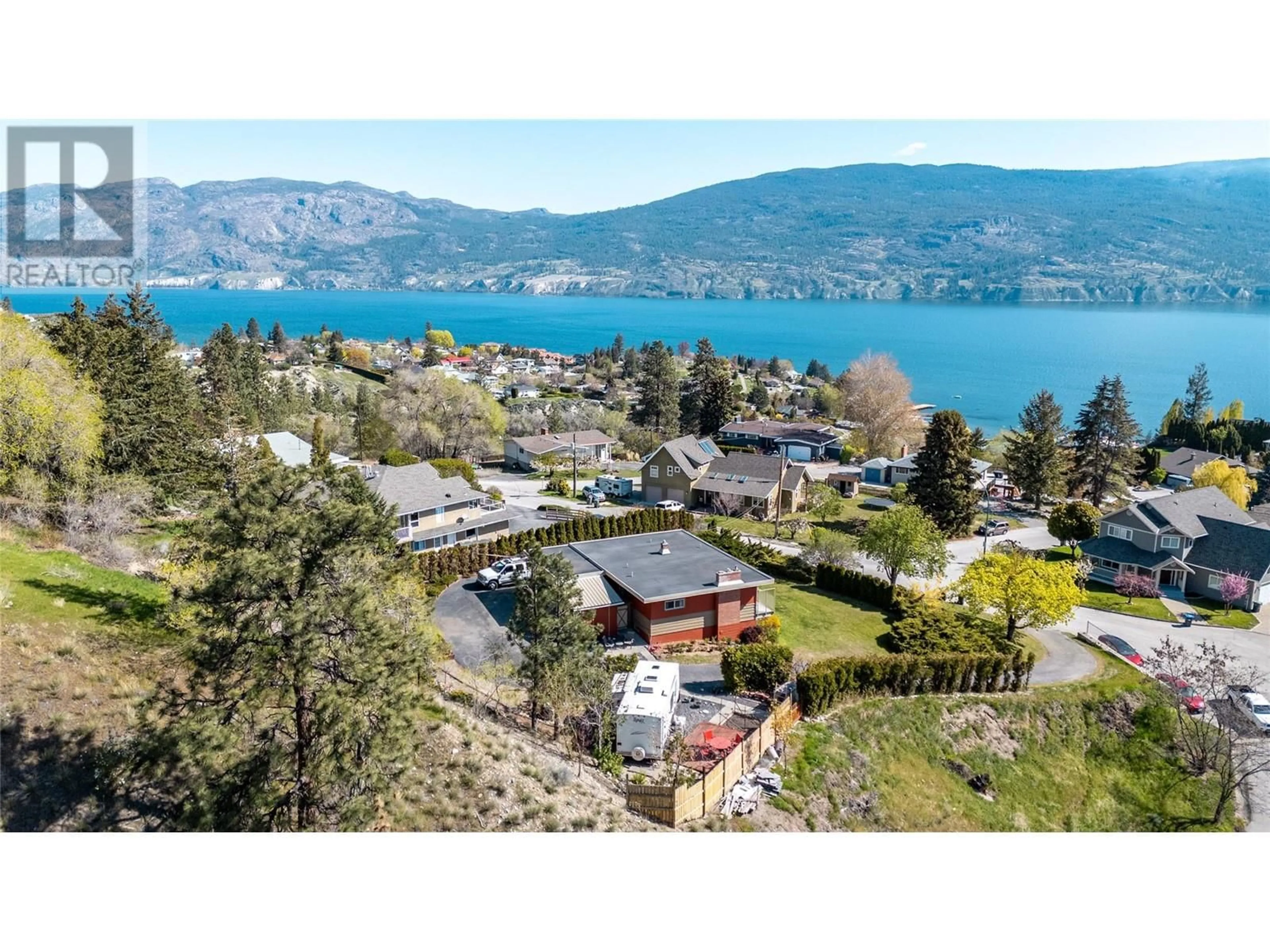 A pic from outside/outdoor area/front of a property/back of a property/a pic from drone, water/lake/river/ocean view for 13006 BRISTOW ROAD, Summerland British Columbia V0H1Z1
