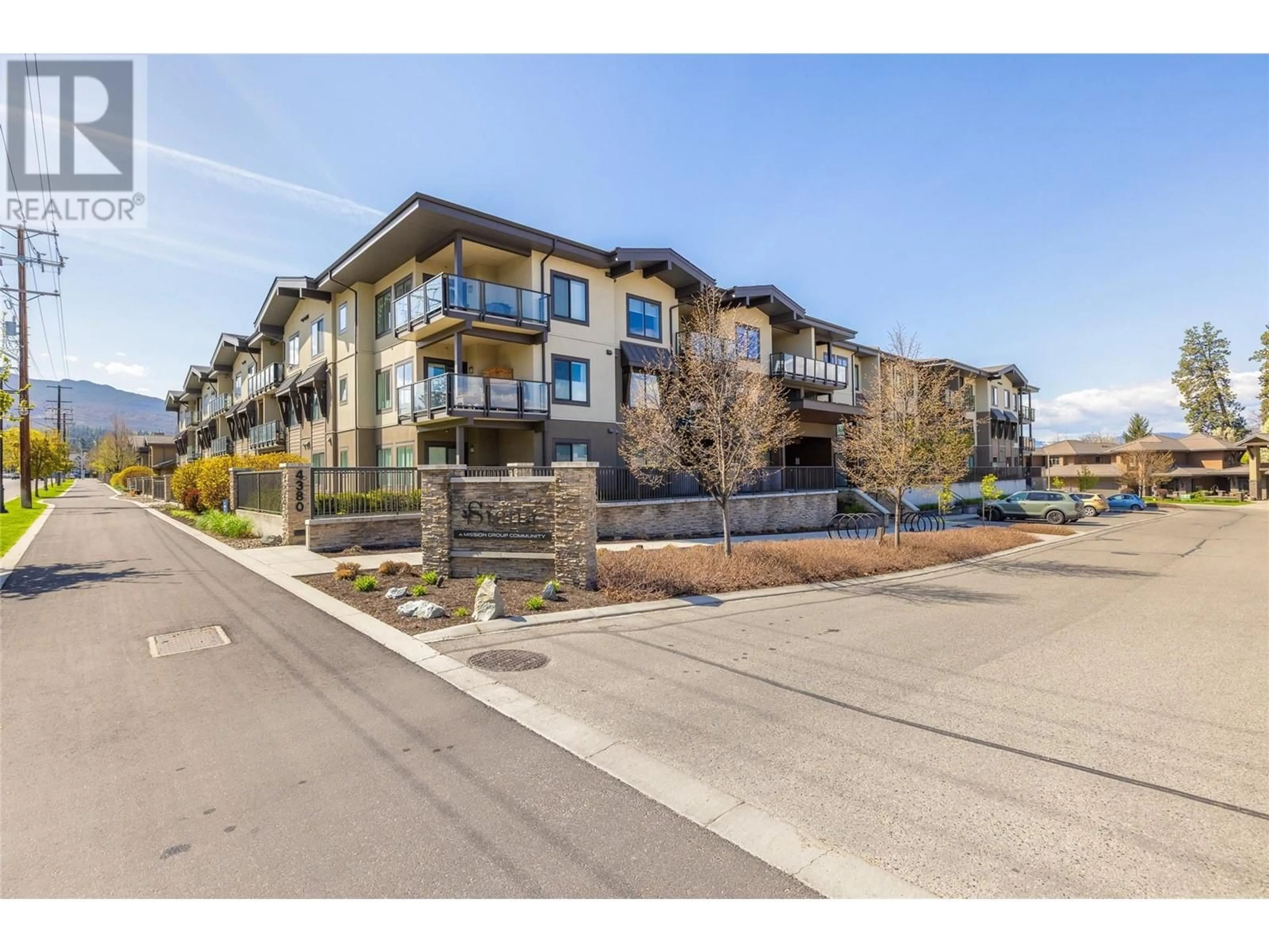 A pic from outside/outdoor area/front of a property/back of a property/a pic from drone, unknown for 108 - 4380 LAKESHORE ROAD, Kelowna British Columbia V1W5H5