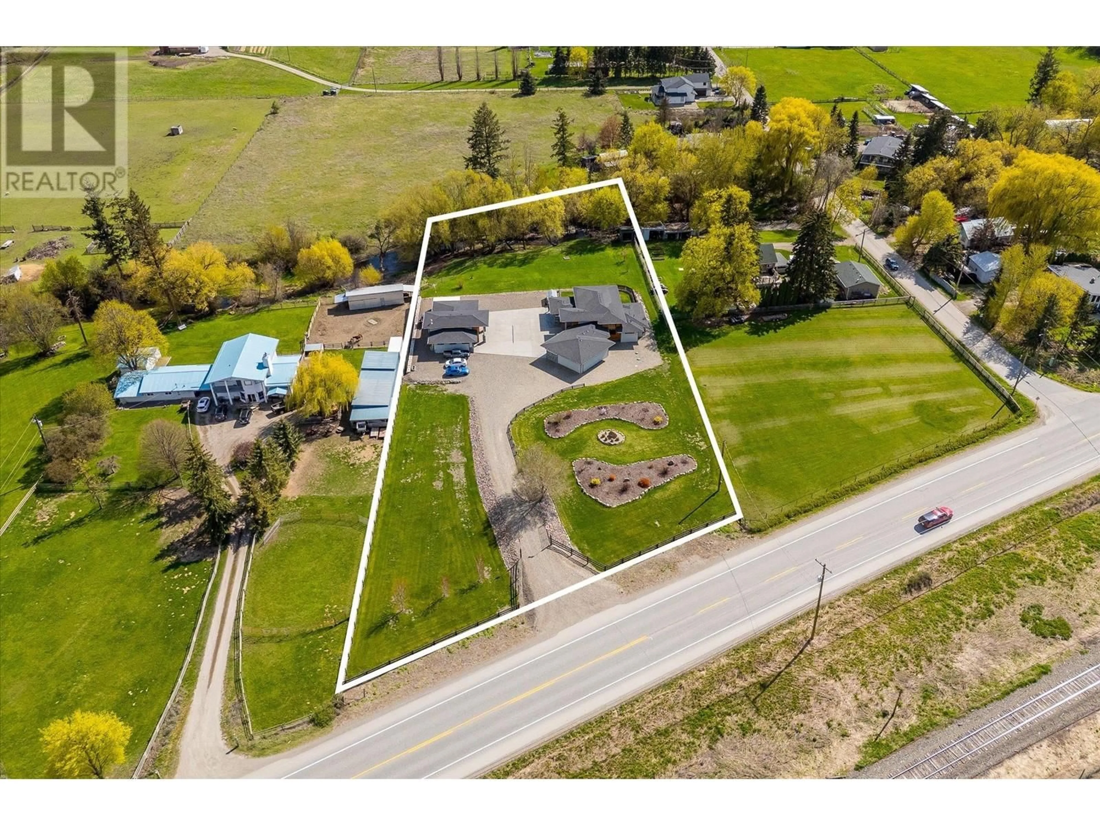 A pic from outside/outdoor area/front of a property/back of a property/a pic from drone, street for 7260 6 HIGHWAY, Coldstream British Columbia V1B3H4