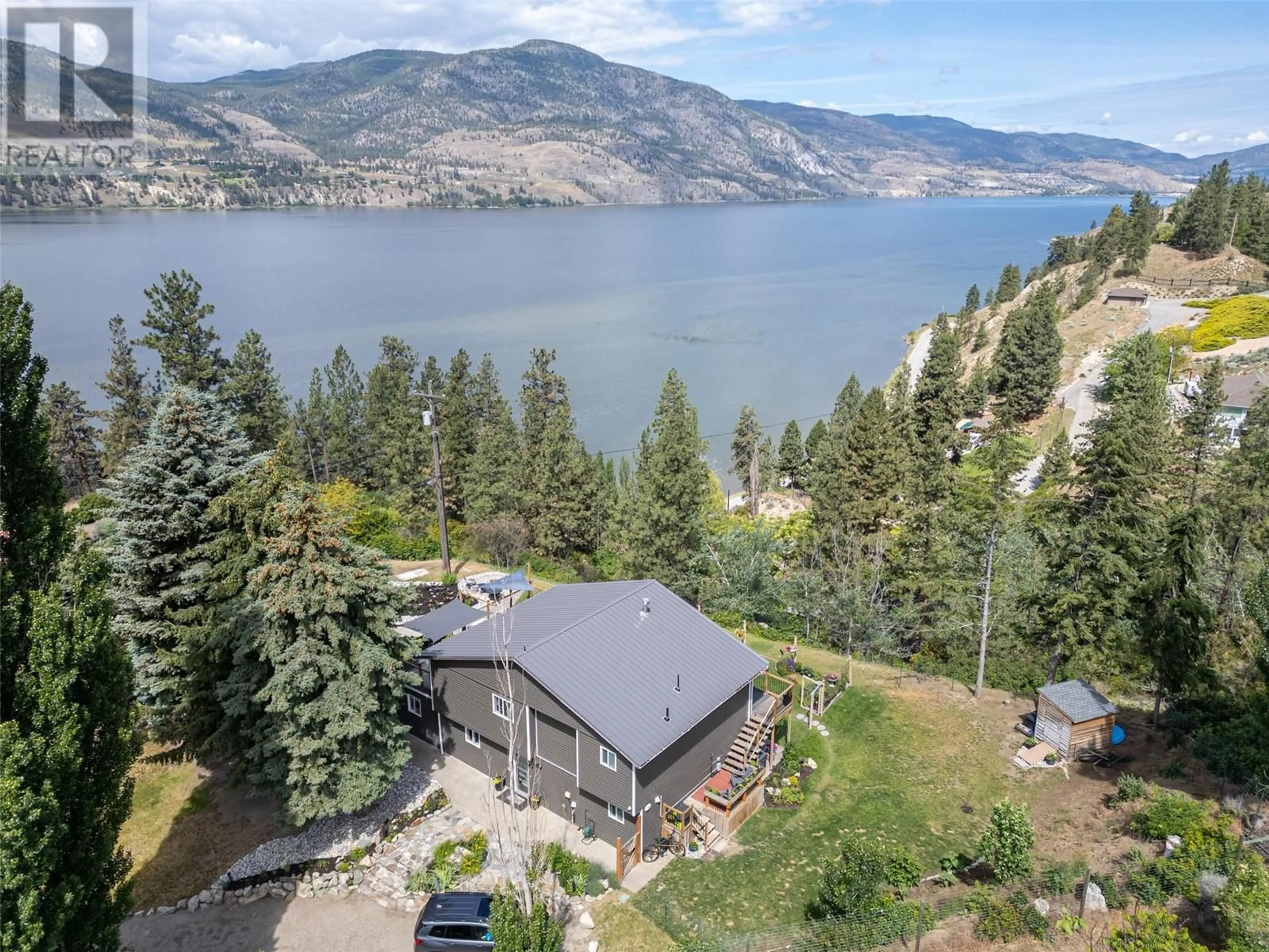 A pic from outside/outdoor area/front of a property/back of a property/a pic from drone, water/lake/river/ocean view for 126 CONIFER DRIVE, Okanagan Falls British Columbia V0H1R3