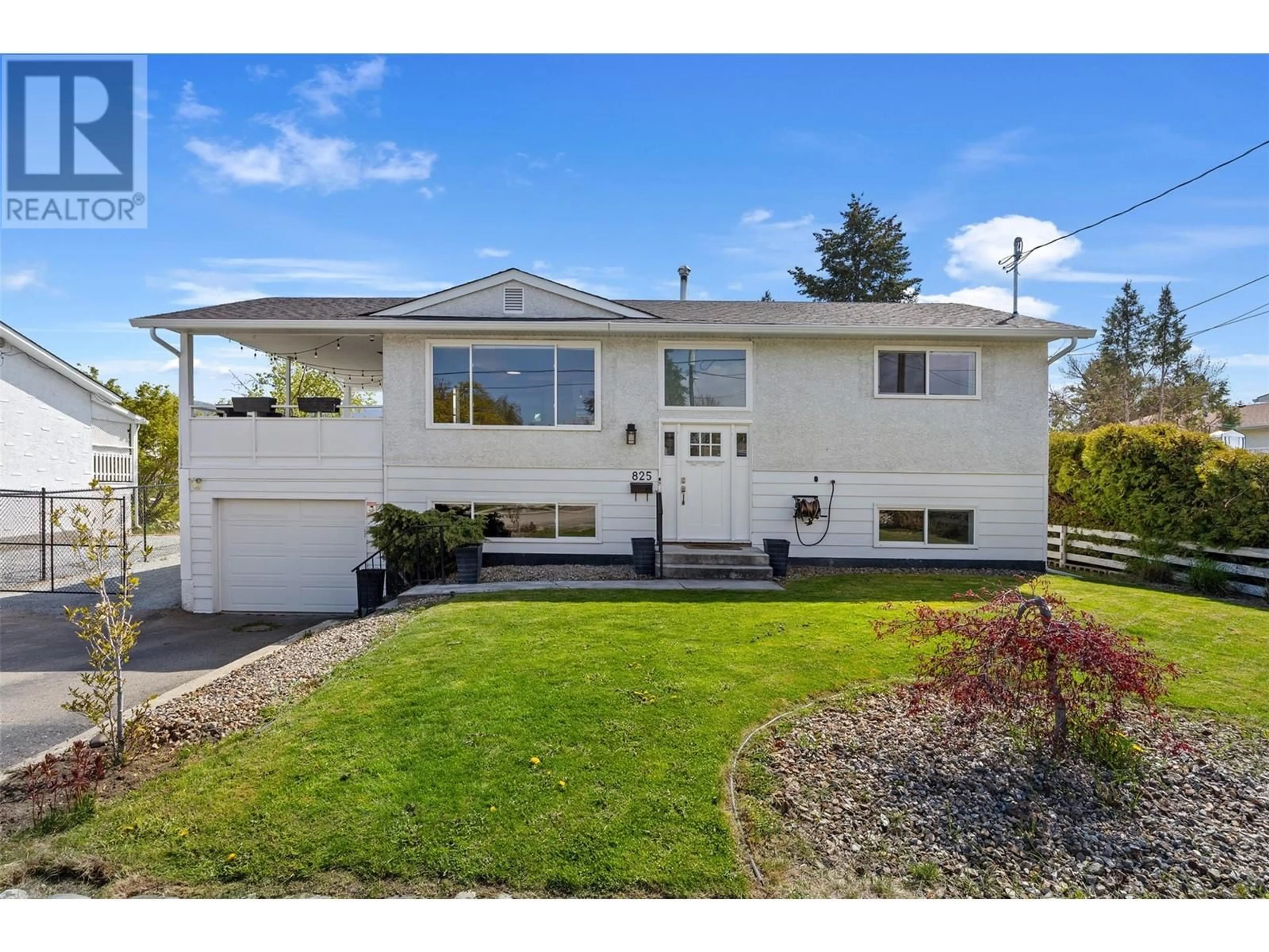 Home with vinyl exterior material, street for 825 BRIAN ROAD, Kelowna British Columbia V1X1H5