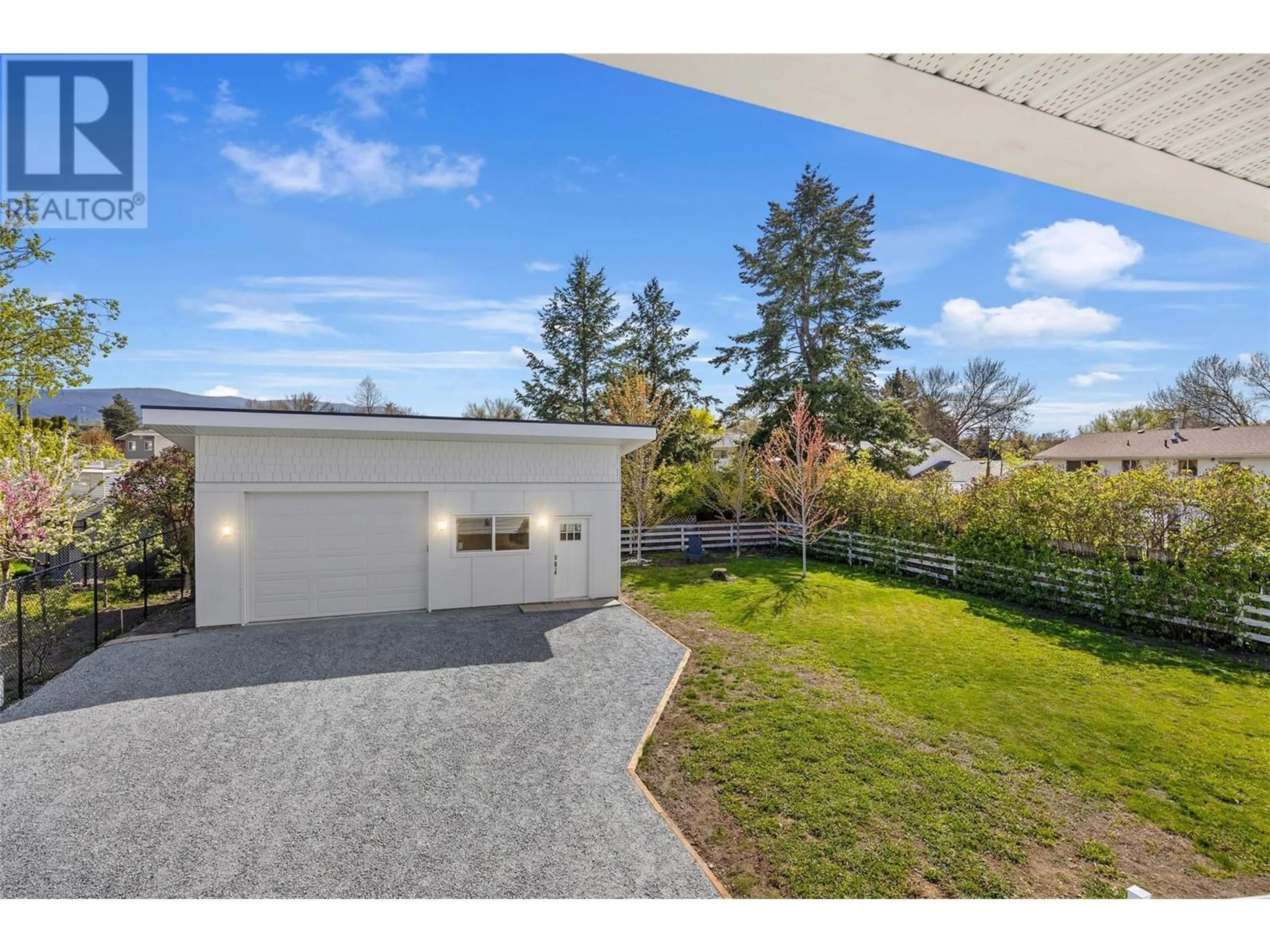 A pic from outside/outdoor area/front of a property/back of a property/a pic from drone, street for 825 BRIAN ROAD, Kelowna British Columbia V1X1H5