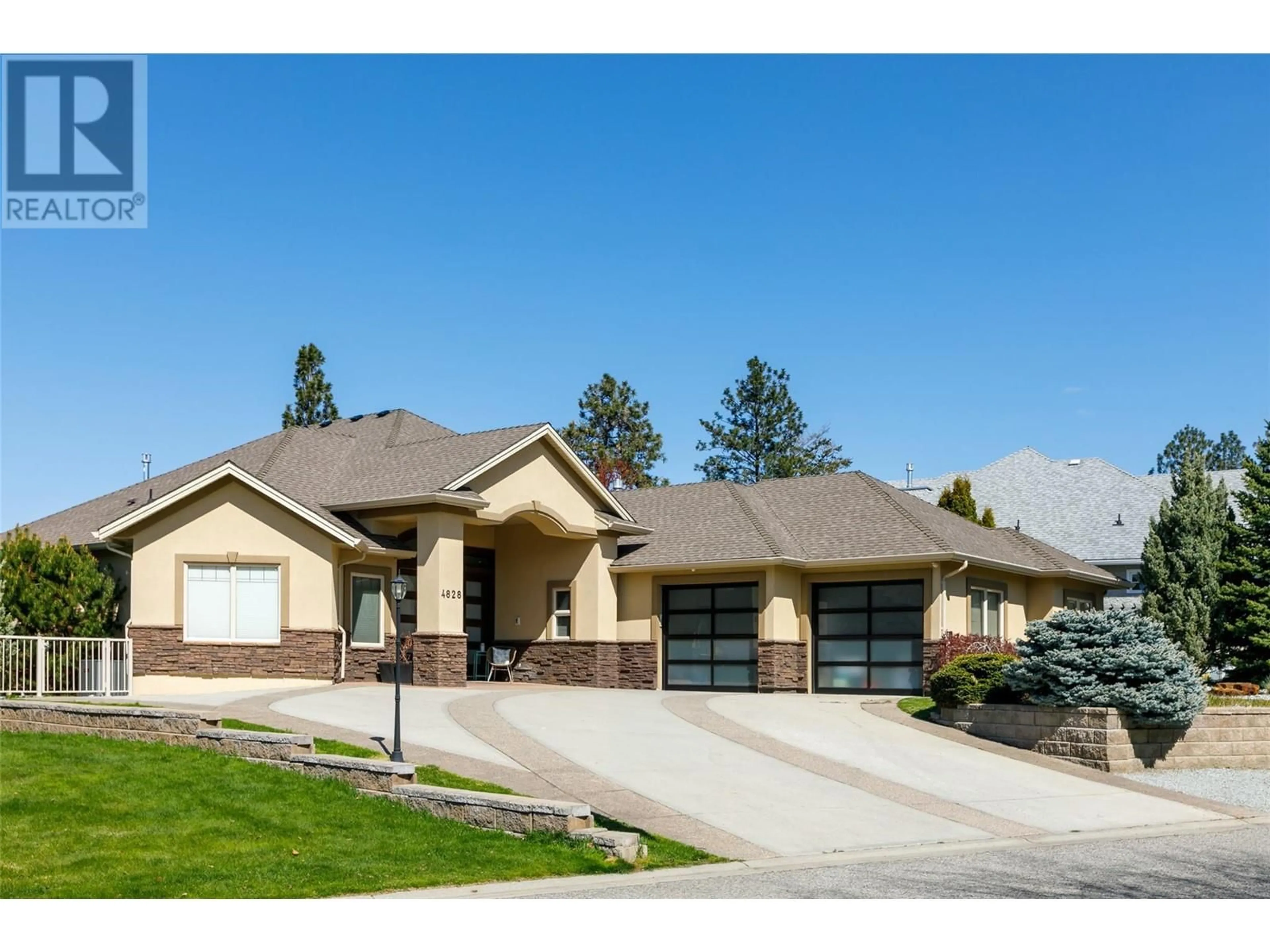 Home with brick exterior material, street for 4828 CARMEL CRESCENT, Kelowna British Columbia V1W5B9