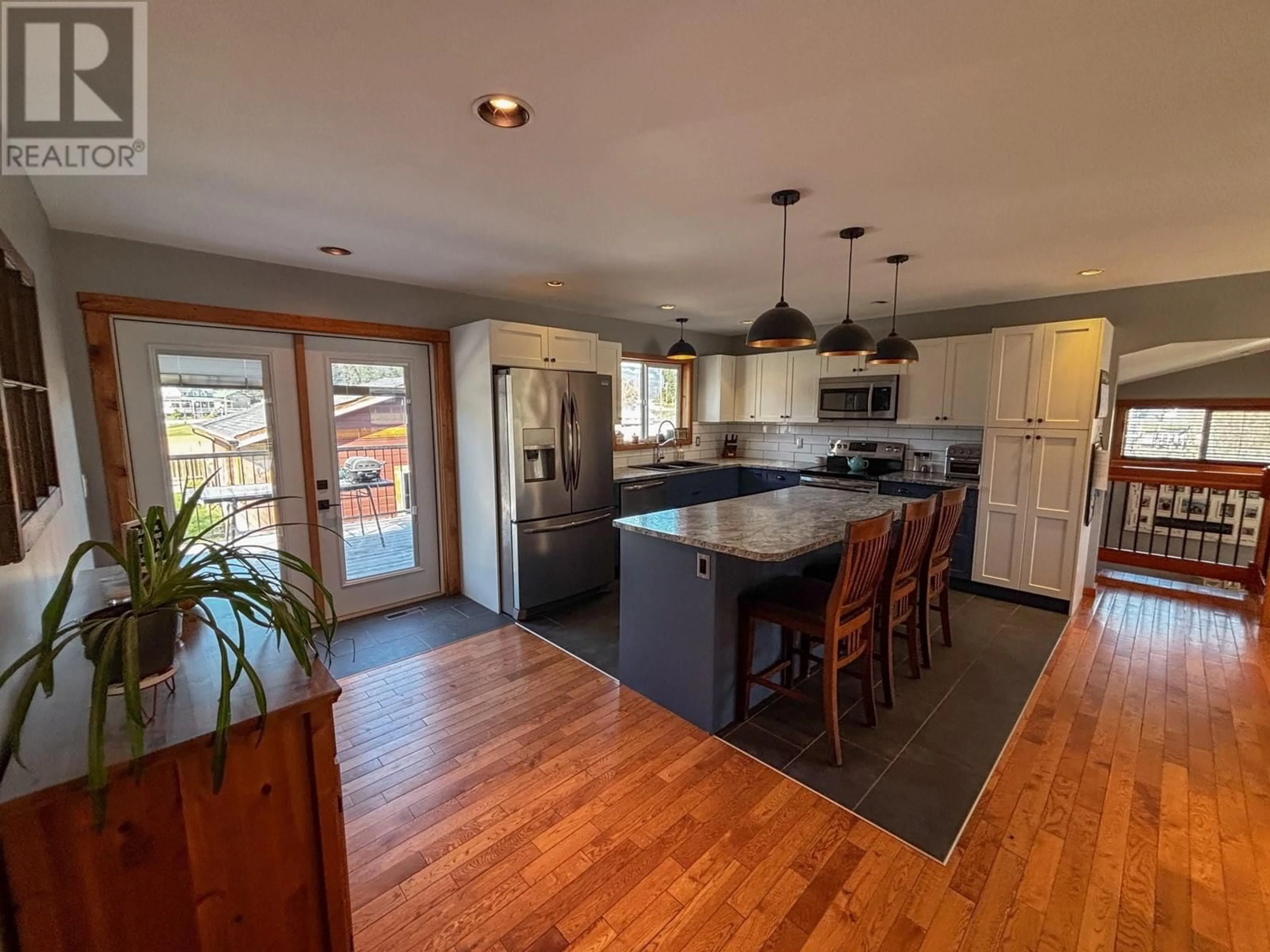 Open concept kitchen, wood/laminate floor for 5729 COLUMBIA ROAD, Edgewater British Columbia V0A1E0