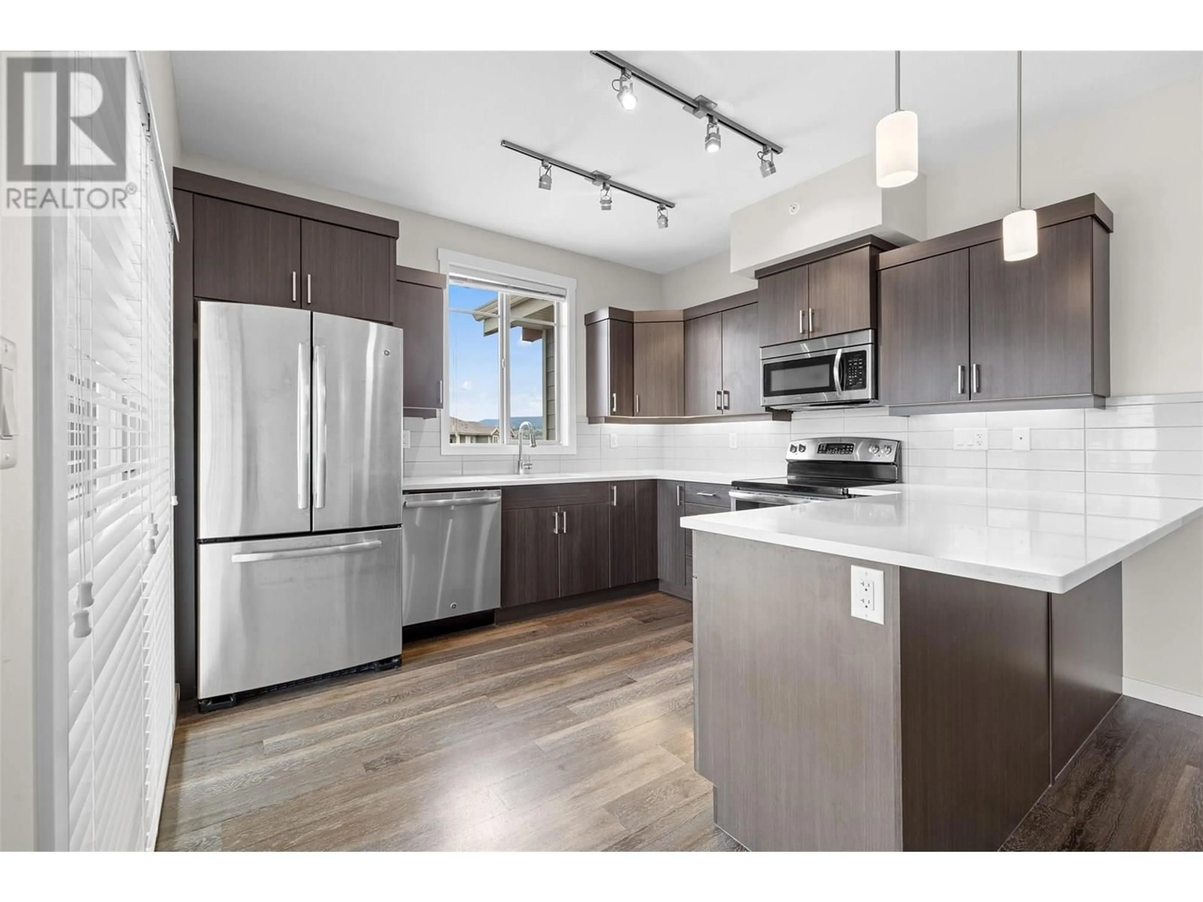 Open concept kitchen, unknown for 412 - 3731 CASORSO ROAD, Kelowna British Columbia V1W5E9
