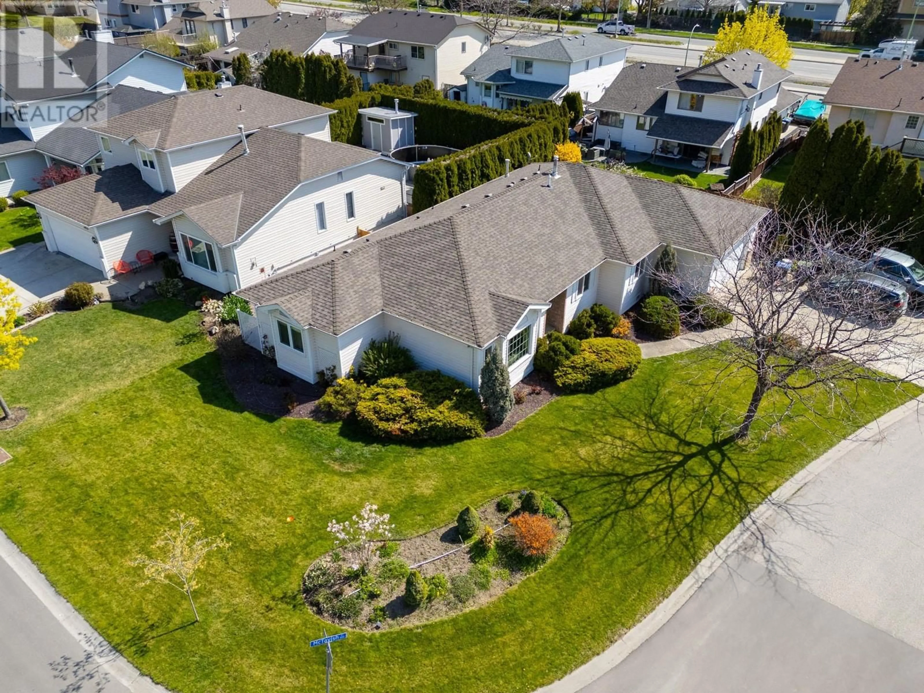 A pic from outside/outdoor area/front of a property/back of a property/a pic from drone, street for 390 MCTAVISH CRESCENT, Kelowna British Columbia V1V1P1