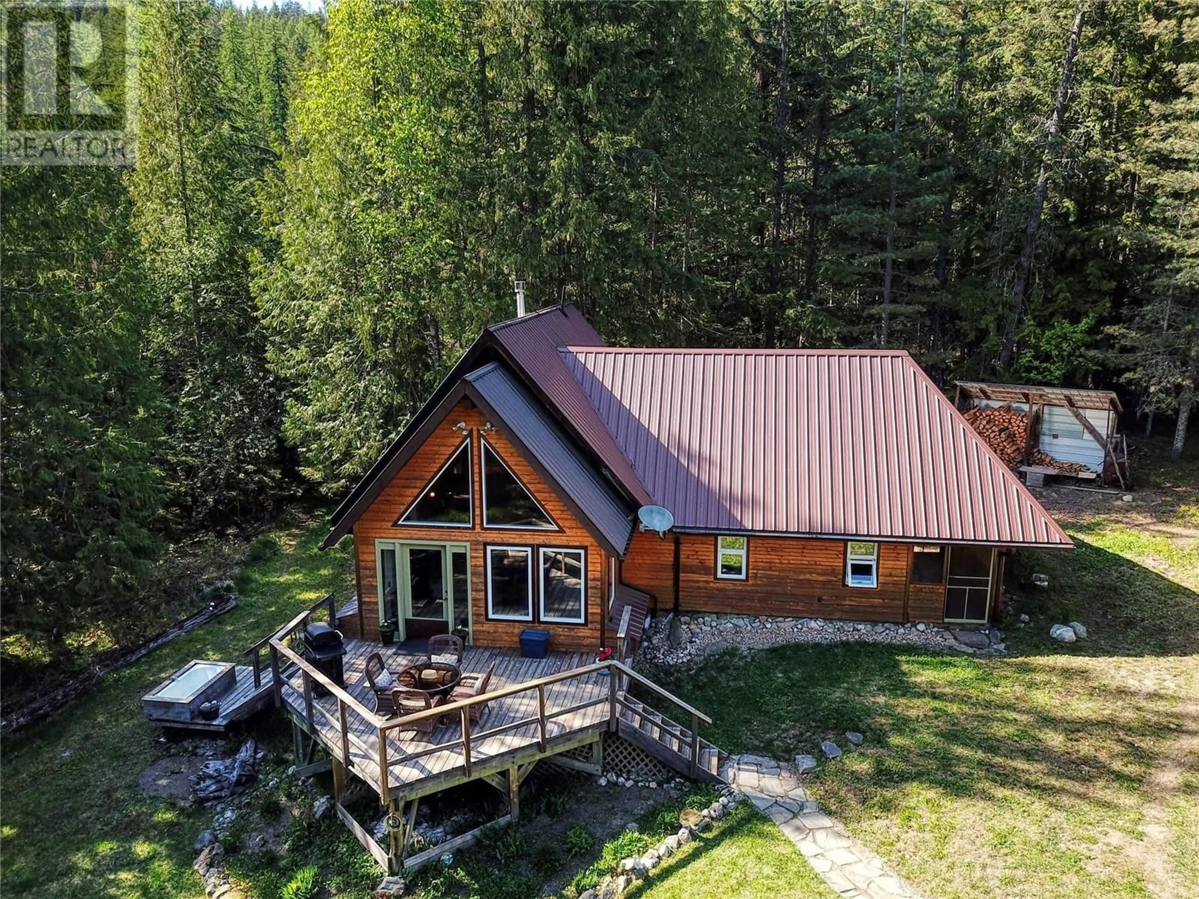A pic from outside/outdoor area/front of a property/back of a property/a pic from drone, unknown for 16317 CEDAR ROAD, Crawford Bay British Columbia V0B1E0