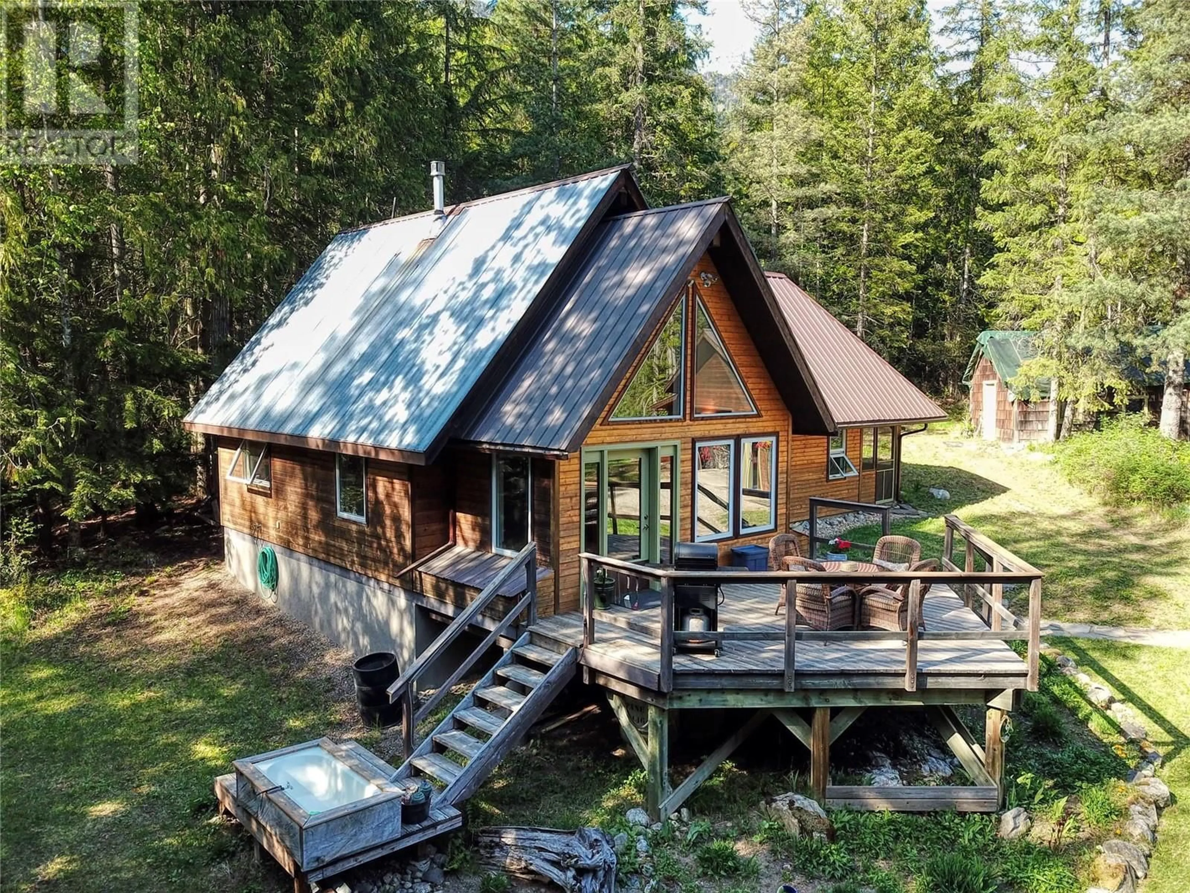 A pic from outside/outdoor area/front of a property/back of a property/a pic from drone, unknown for 16317 CEDAR ROAD, Crawford Bay British Columbia V0B1E0