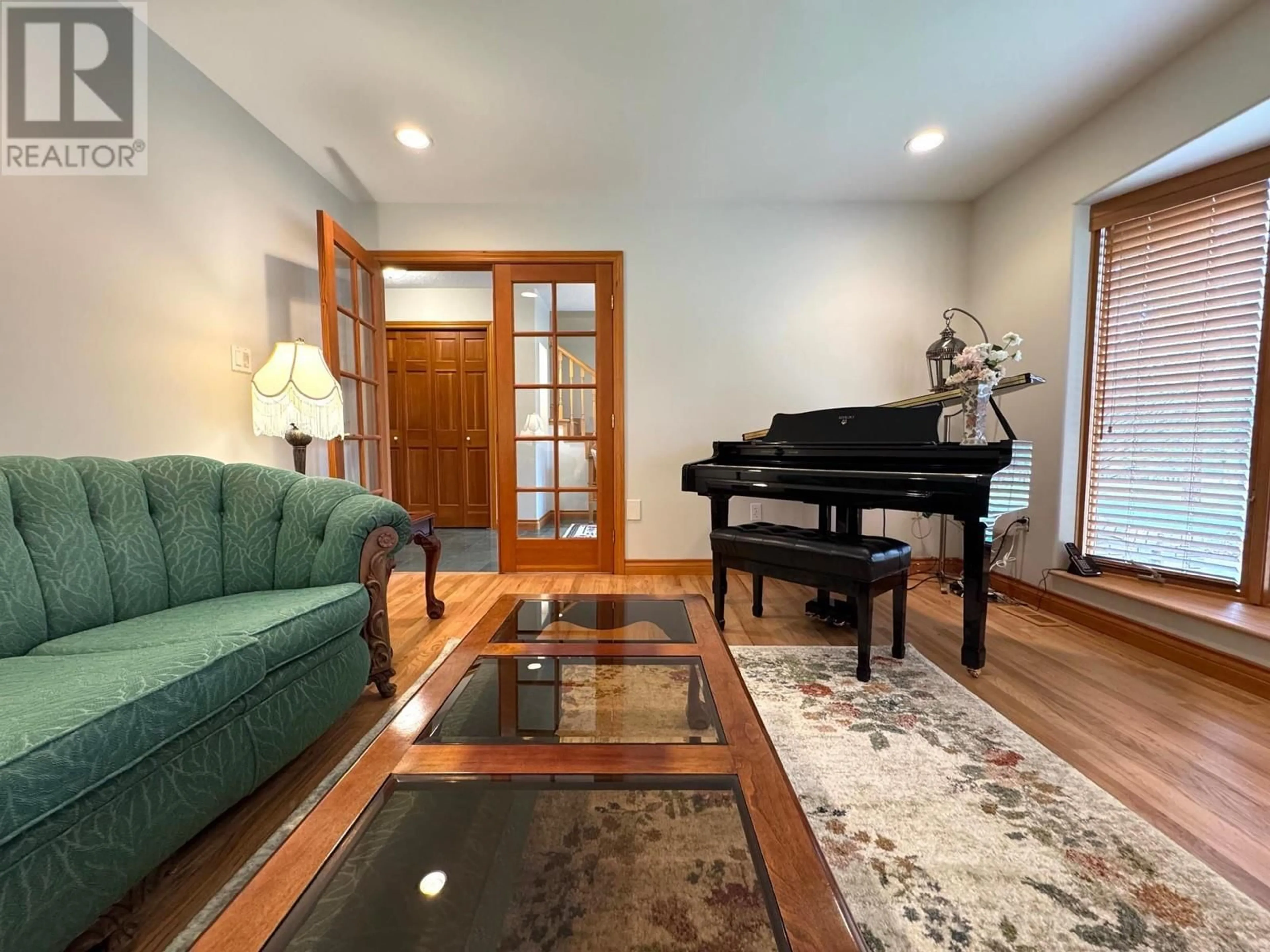Living room with furniture, wood/laminate floor for 2151 MUNRO CRESCENT, Merritt British Columbia V1K1H8