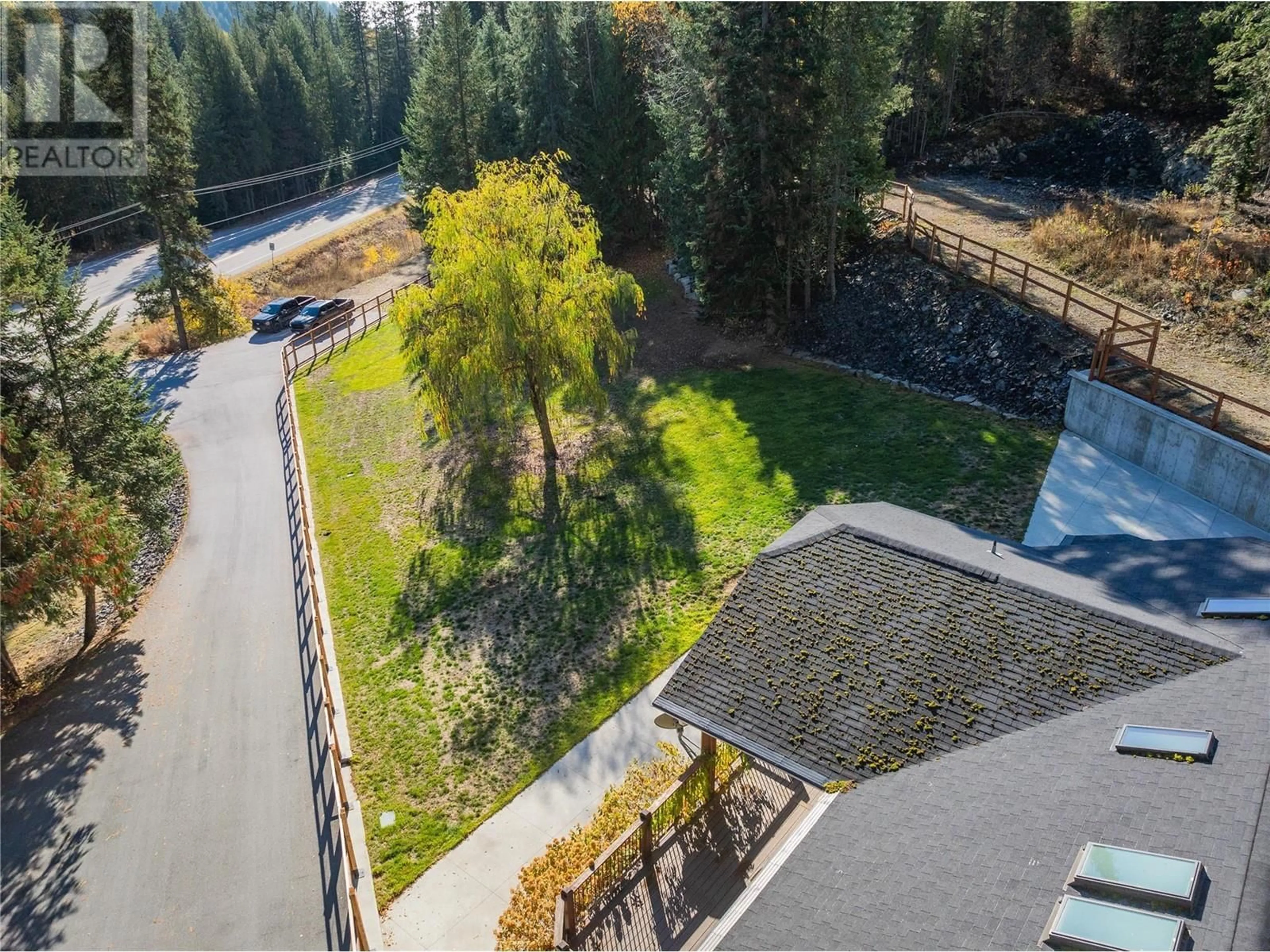 A pic from outside/outdoor area/front of a property/back of a property/a pic from drone, forest/trees view for 635 HIGHWAY 22 HIGHWAY, Rossland British Columbia V0G1Y0