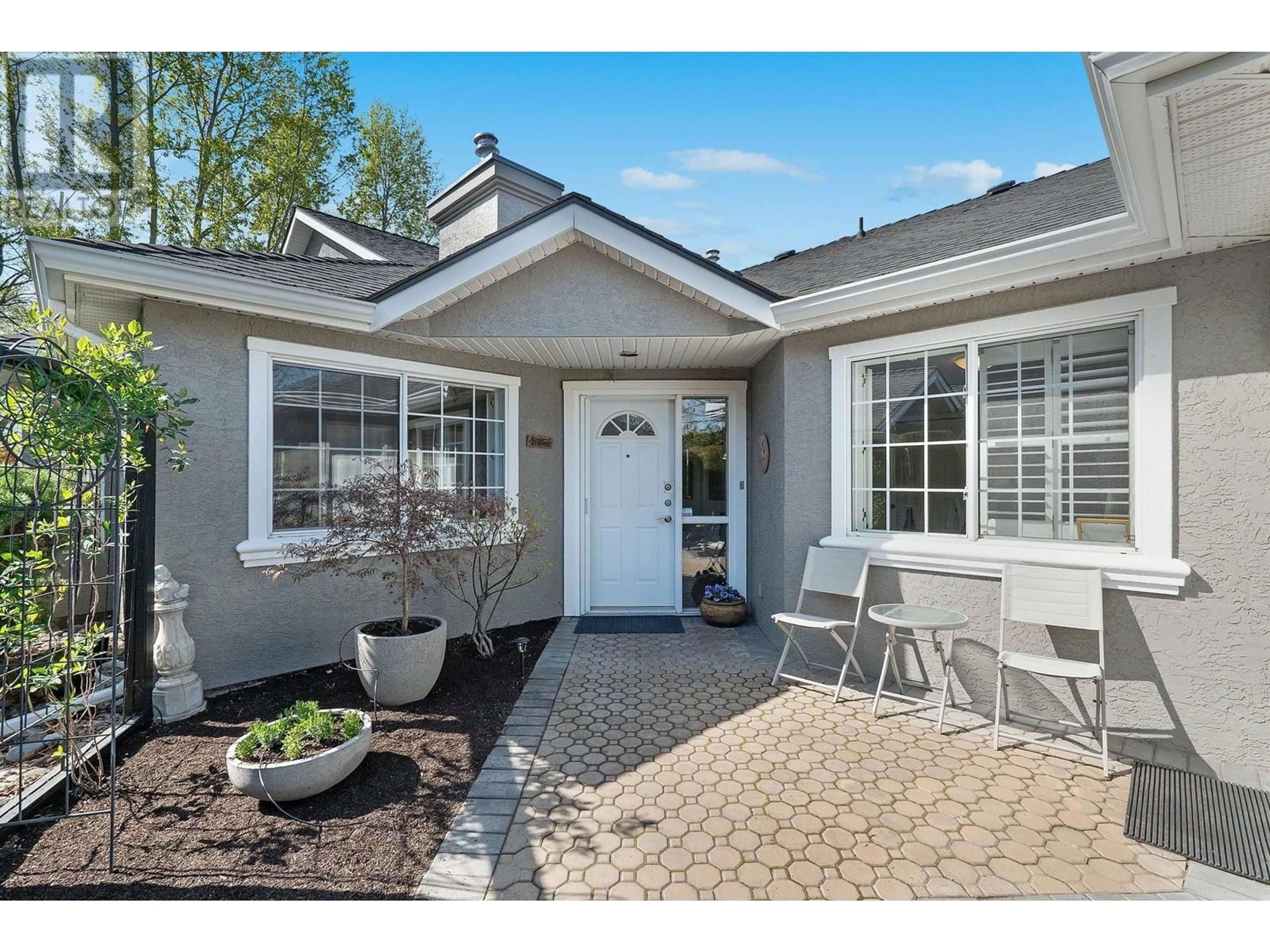 Home with vinyl exterior material, street for 9 - 3775 SPRINGBROOK ROAD, Kelowna British Columbia V1W4A3