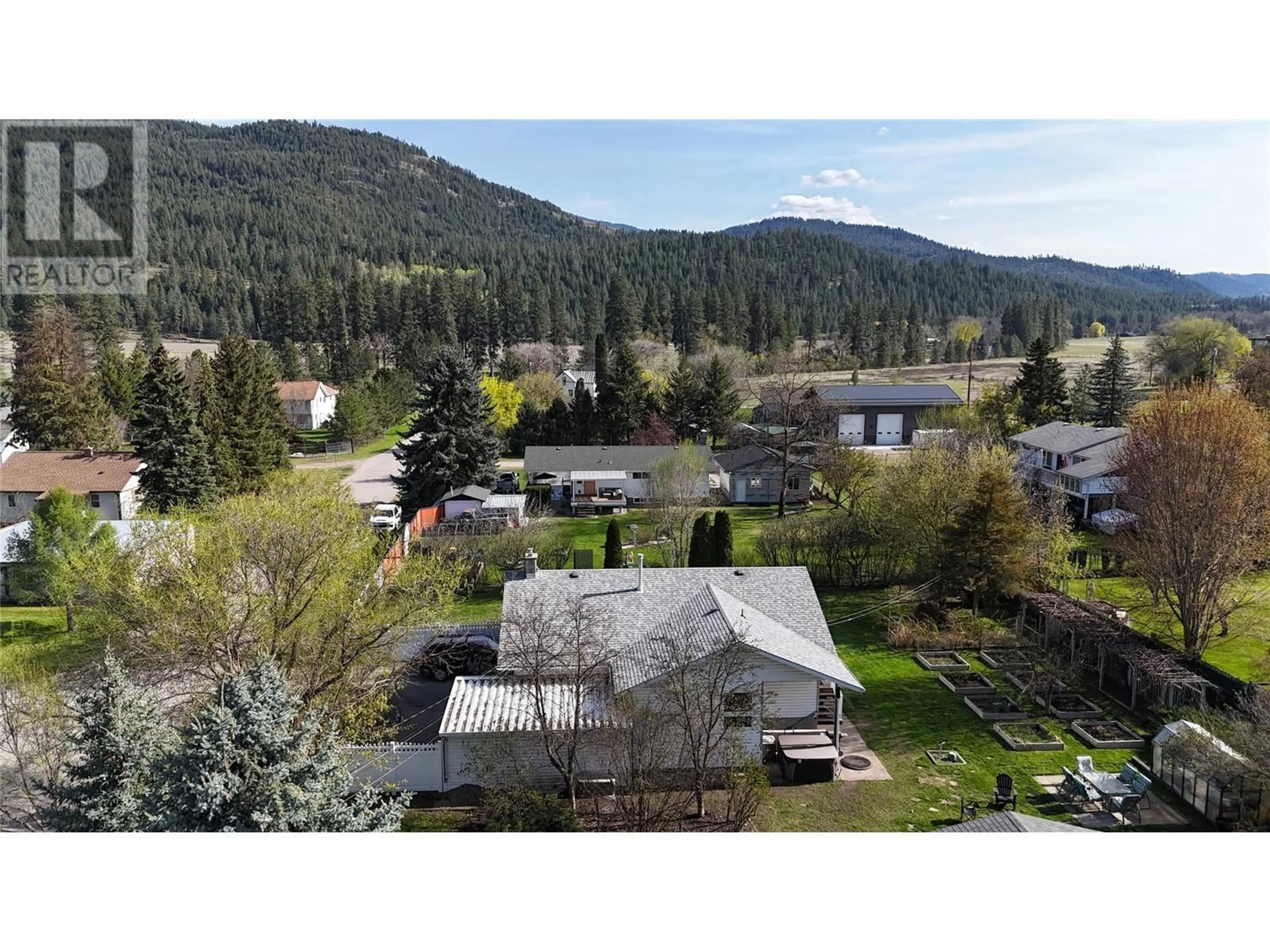 A pic from outside/outdoor area/front of a property/back of a property/a pic from drone, mountain view for 4975 VERNON STREET, Grand Forks British Columbia V0H1H5