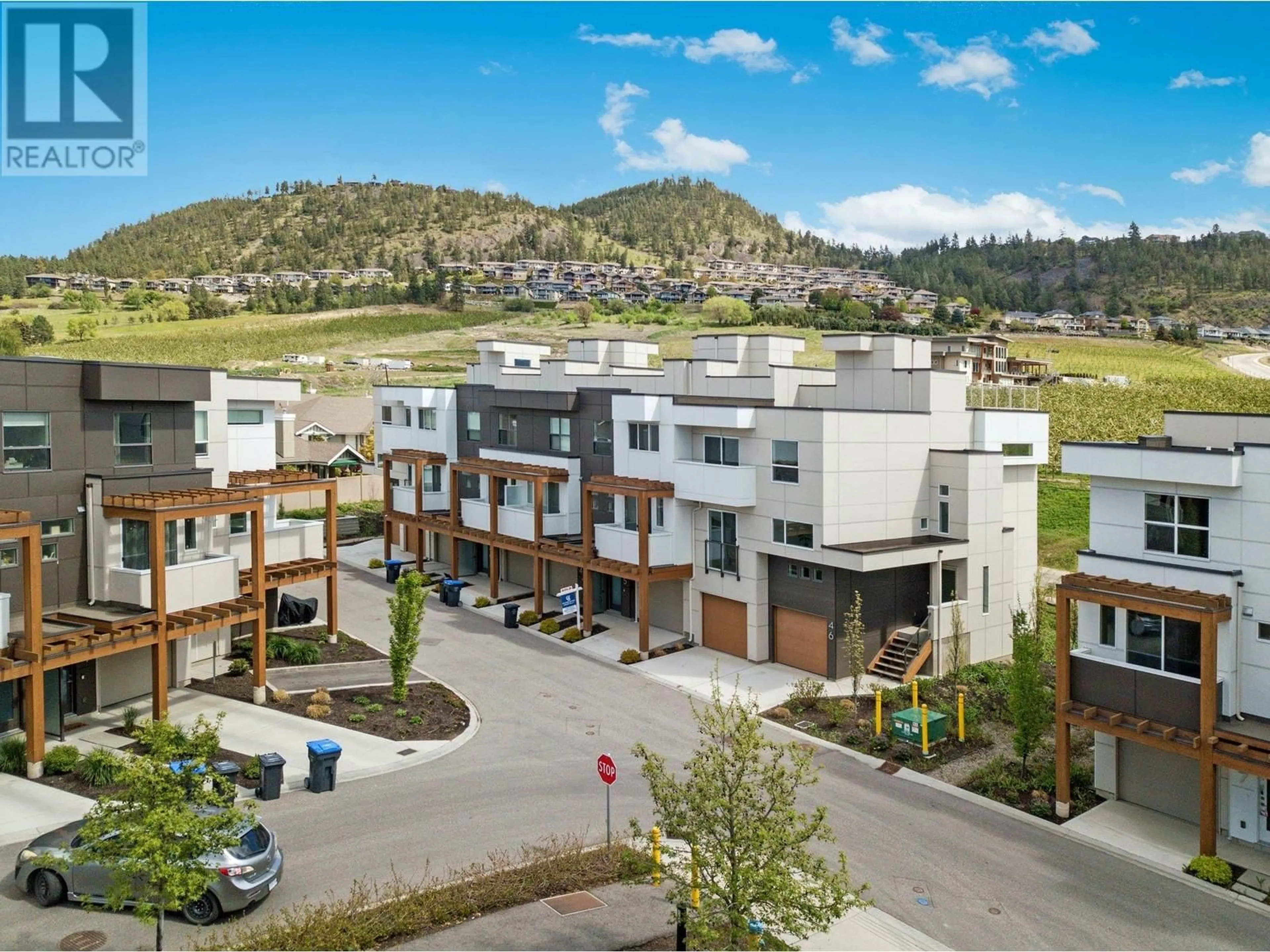 A pic from outside/outdoor area/front of a property/back of a property/a pic from drone, mountain view for 46 - 720 VALLEY ROAD, Kelowna British Columbia V1V0E1