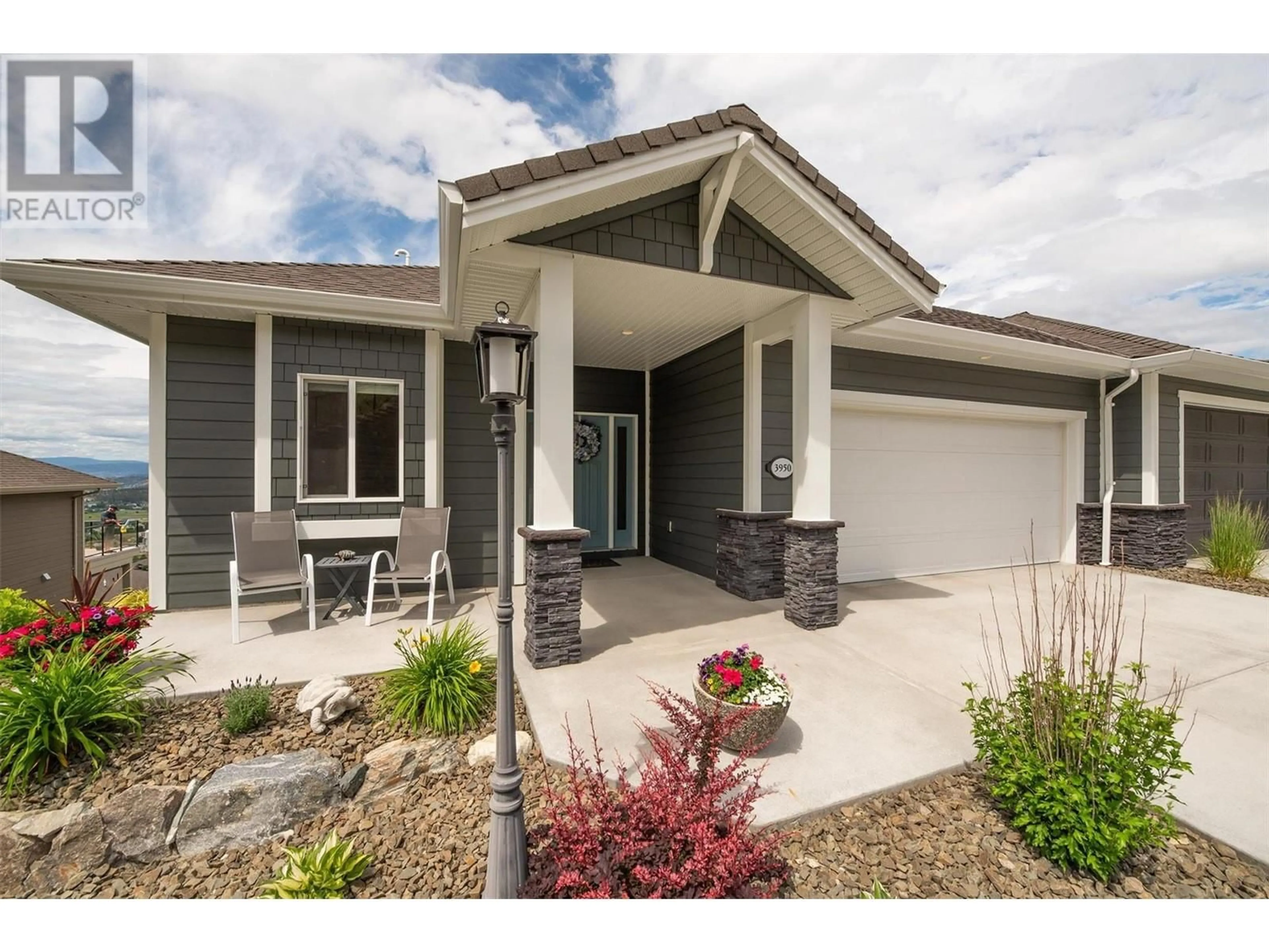 Home with vinyl exterior material, street for 3950 CIMARRON DRIVE, Kelowna British Columbia V1X8E4