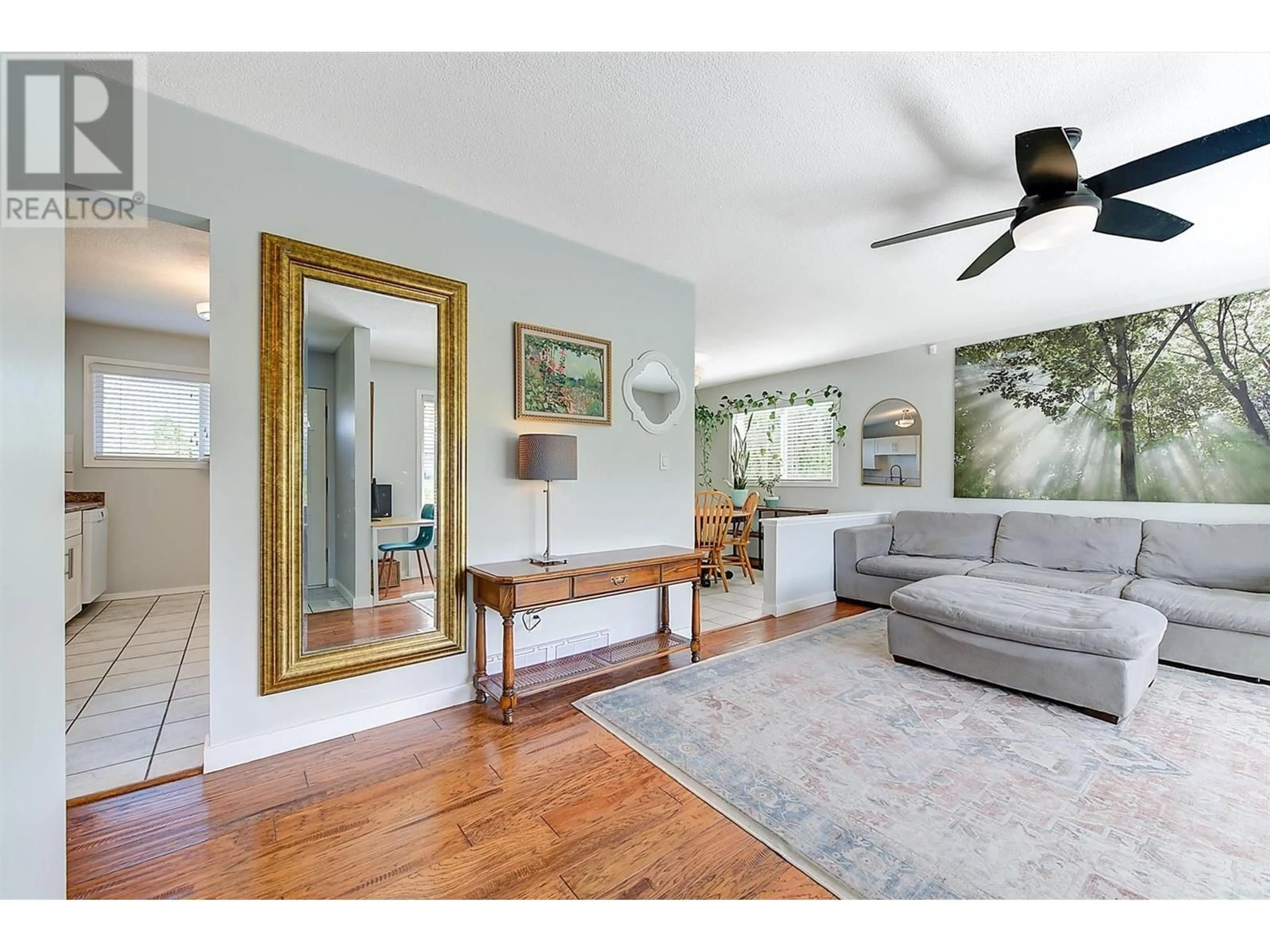Living room with furniture, wood/laminate floor for 3591 BROWN ROAD, West Kelowna British Columbia V4T1P5
