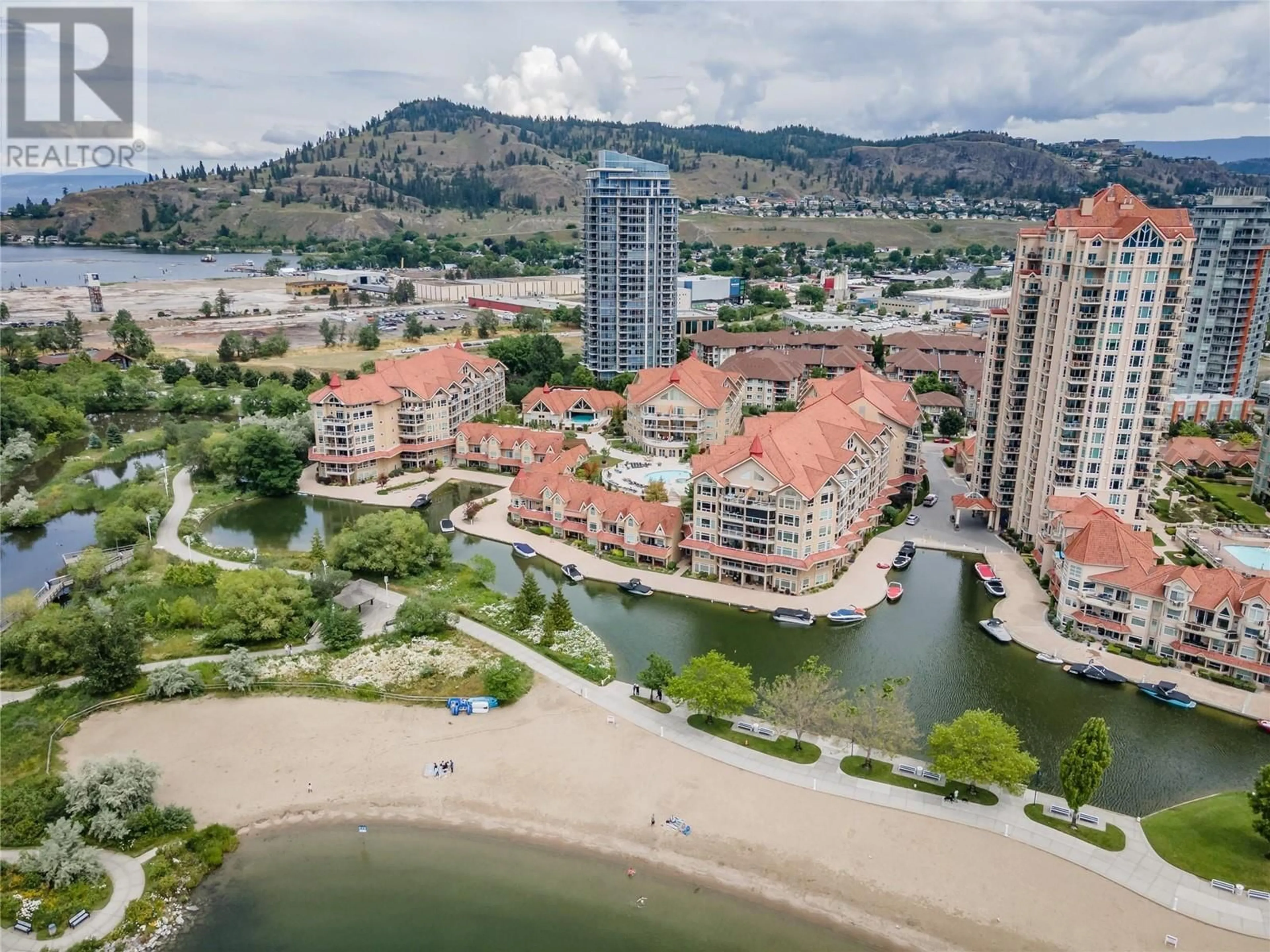 A pic from outside/outdoor area/front of a property/back of a property/a pic from drone, water/lake/river/ocean view for 410 - 1088 SUNSET DRIVE, Kelowna British Columbia V1Y9W1