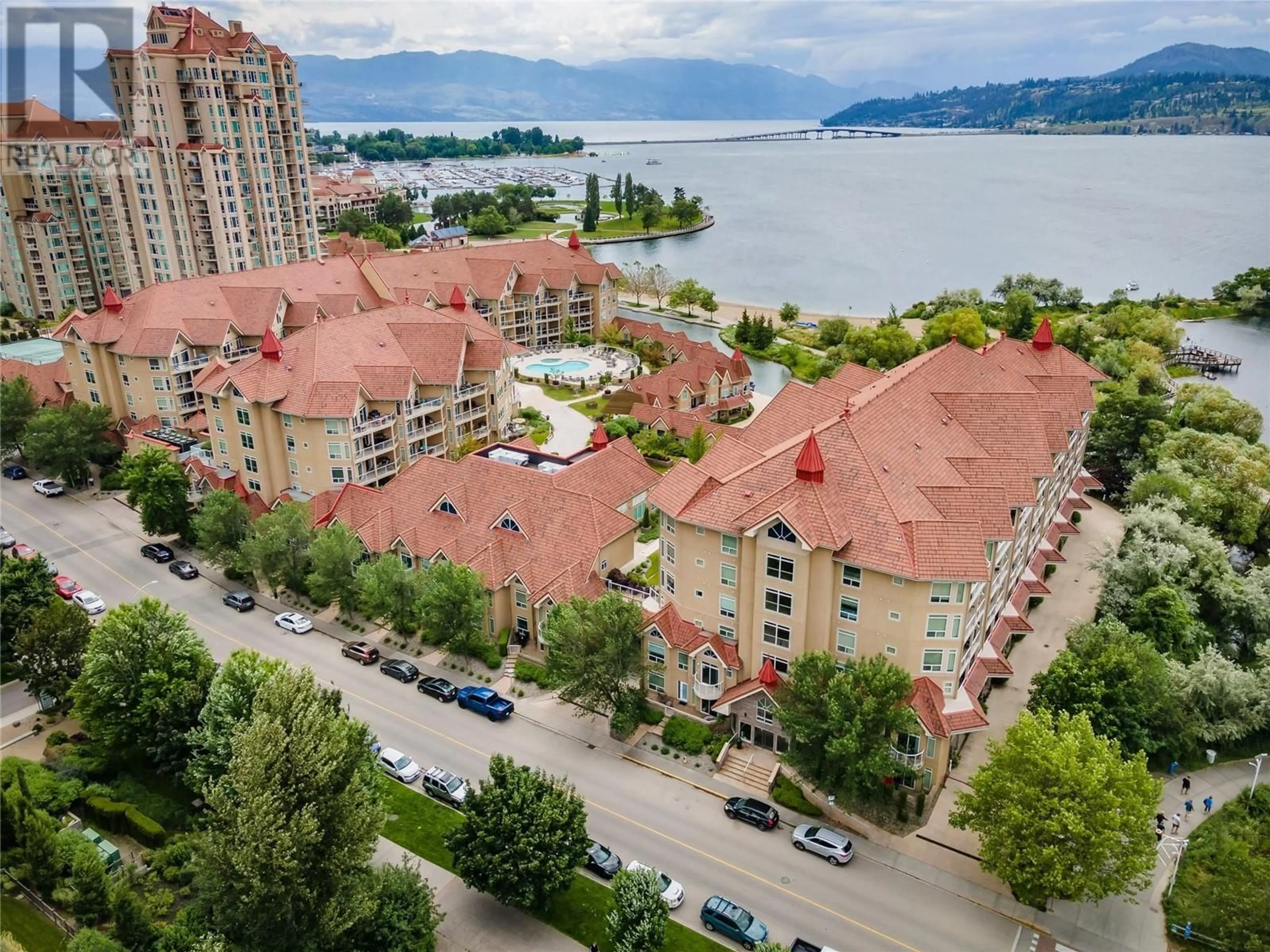 A pic from outside/outdoor area/front of a property/back of a property/a pic from drone, water/lake/river/ocean view for 410 - 1088 SUNSET DRIVE, Kelowna British Columbia V1Y9W1