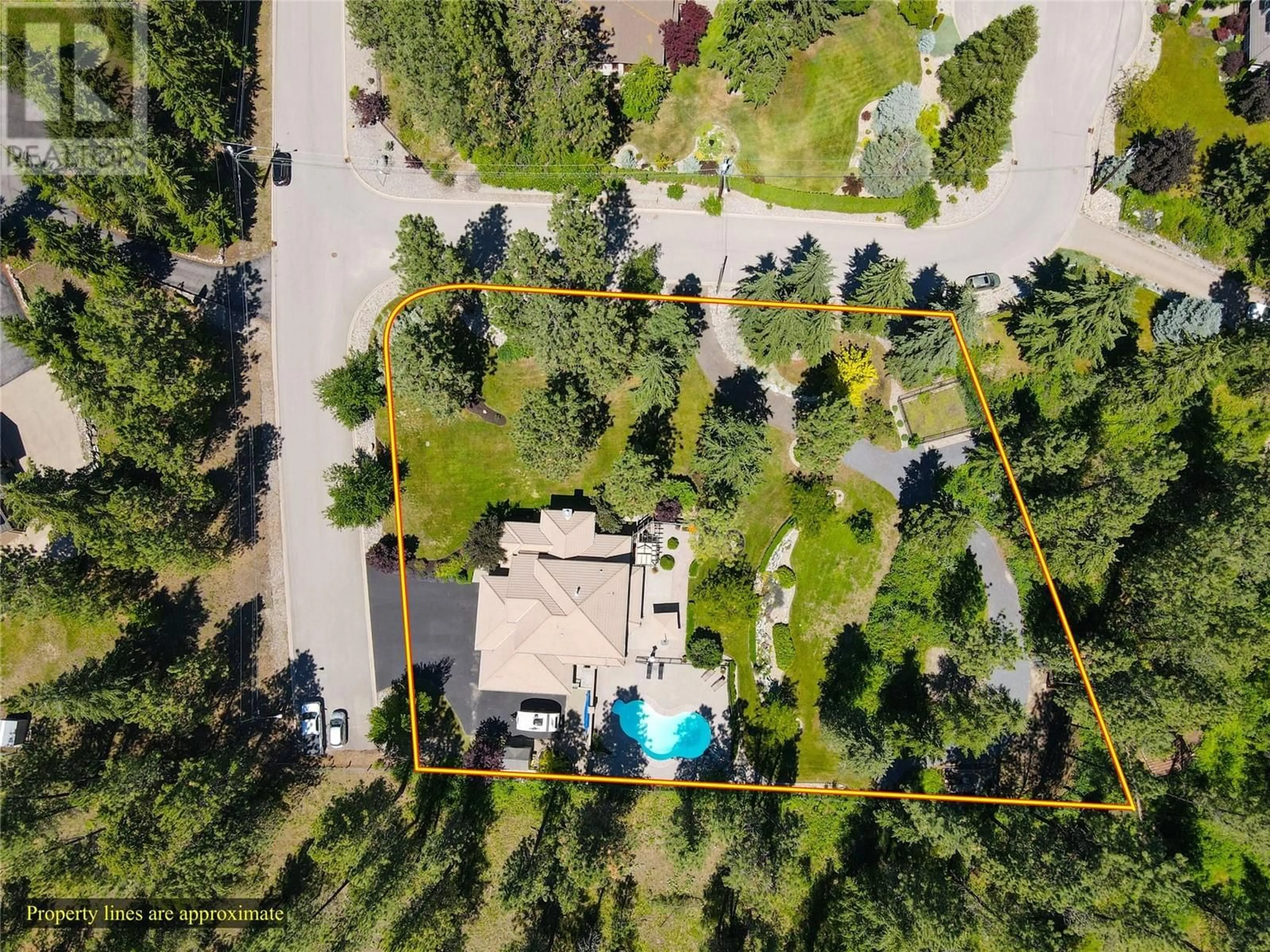 A pic from outside/outdoor area/front of a property/back of a property/a pic from drone, forest/trees view for 4163 MAHONIA DRIVE SOUTH, Kelowna British Columbia V1W4T1