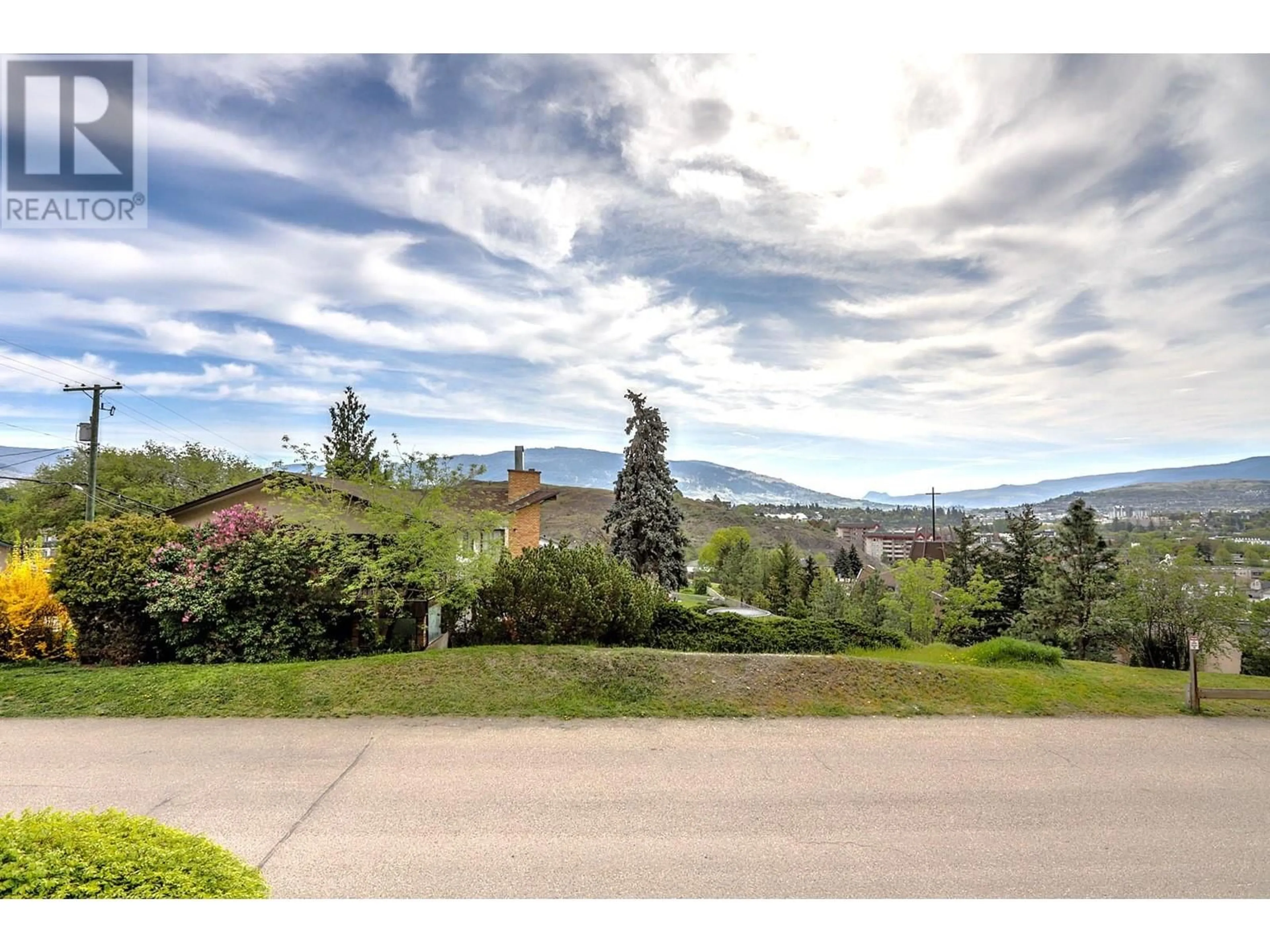 A pic from outside/outdoor area/front of a property/back of a property/a pic from drone, mountain view for 101 - 3808 35 AVENUE, Vernon British Columbia V1T2T9