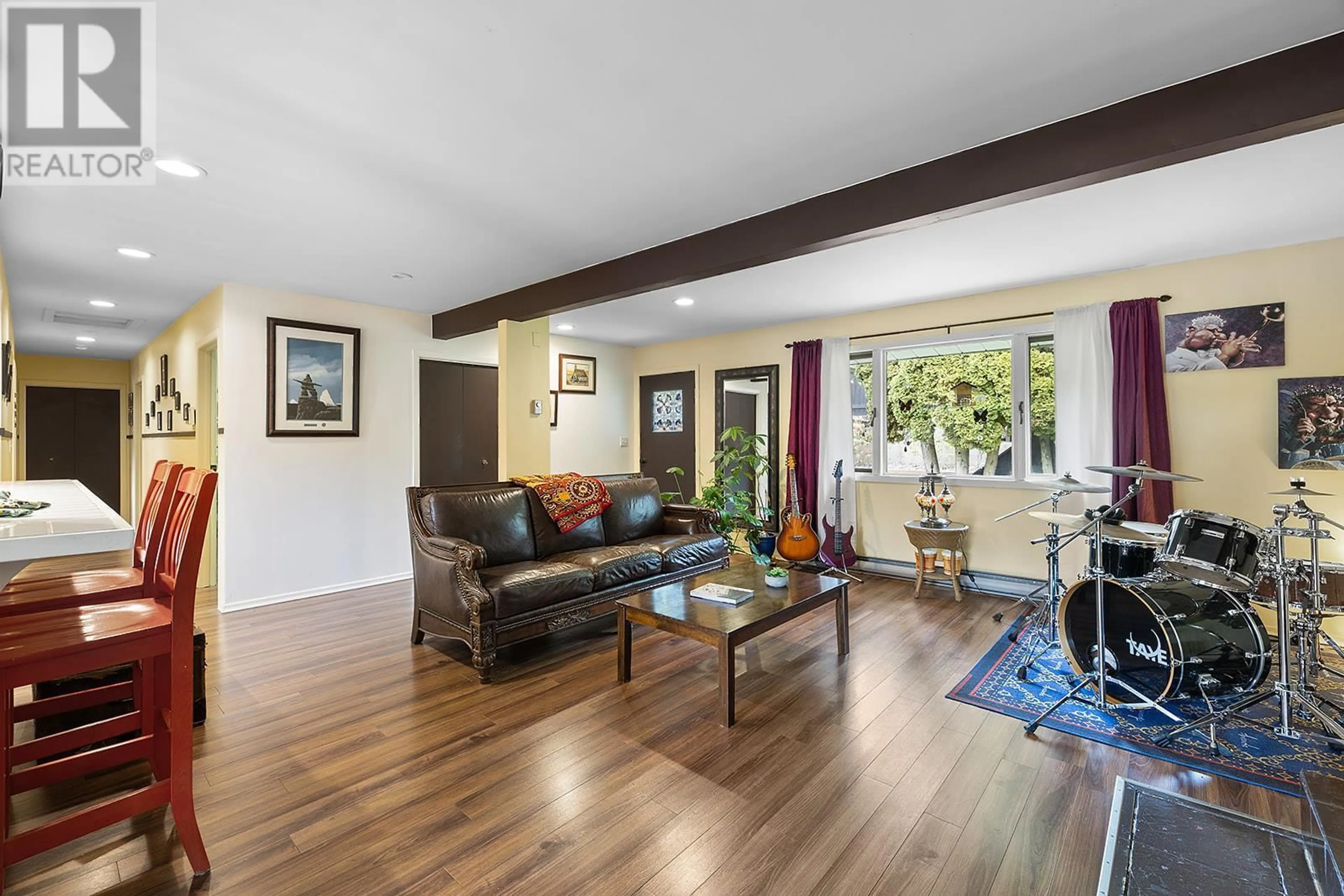 Living room with furniture, wood/laminate floor for 1629 AINSWORTH AVENUE, Riondel British Columbia V0B2B0