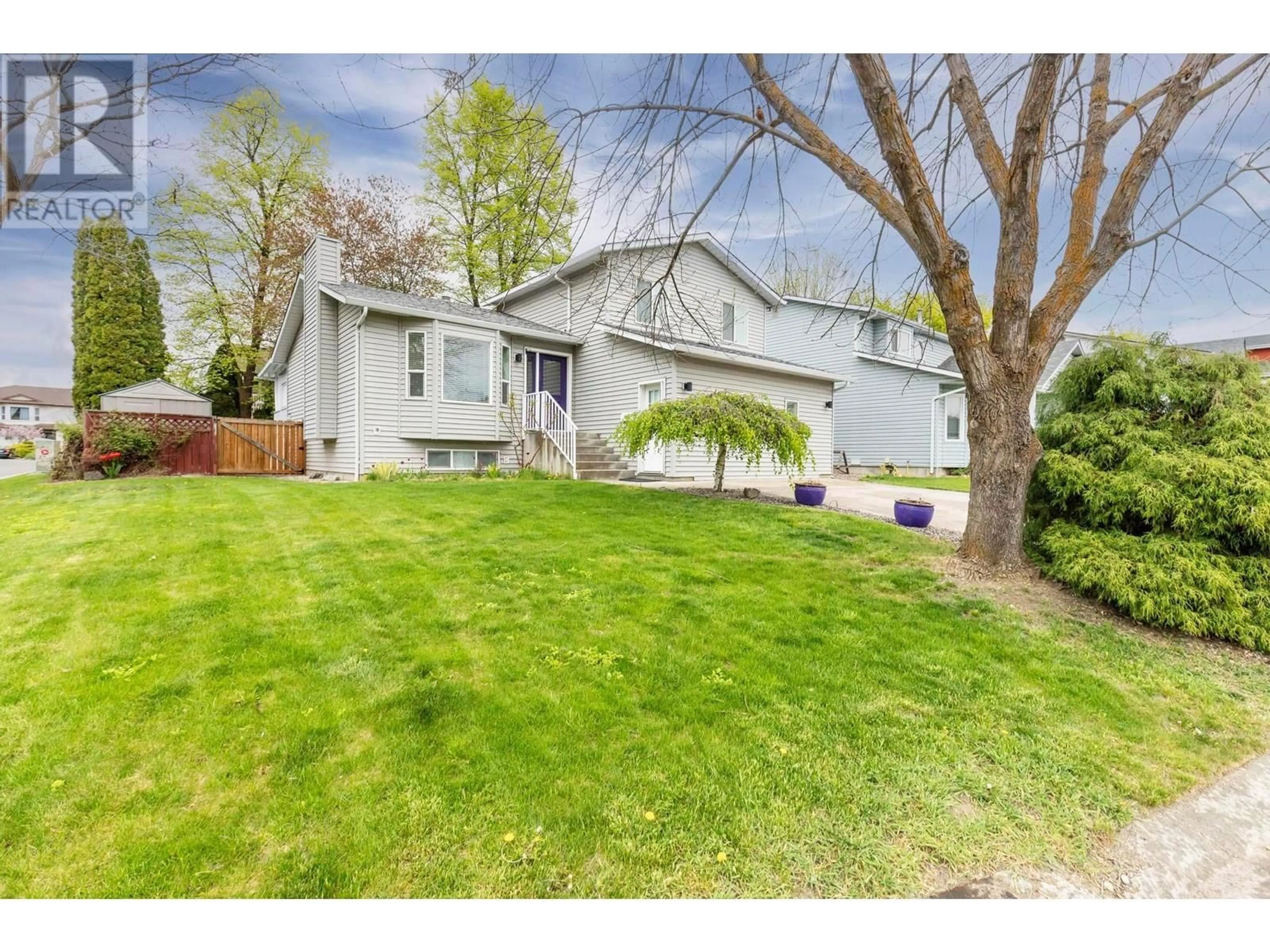 A pic from outside/outdoor area/front of a property/back of a property/a pic from drone, street for 2049 ASTER ROAD, Kelowna British Columbia V1V1P4