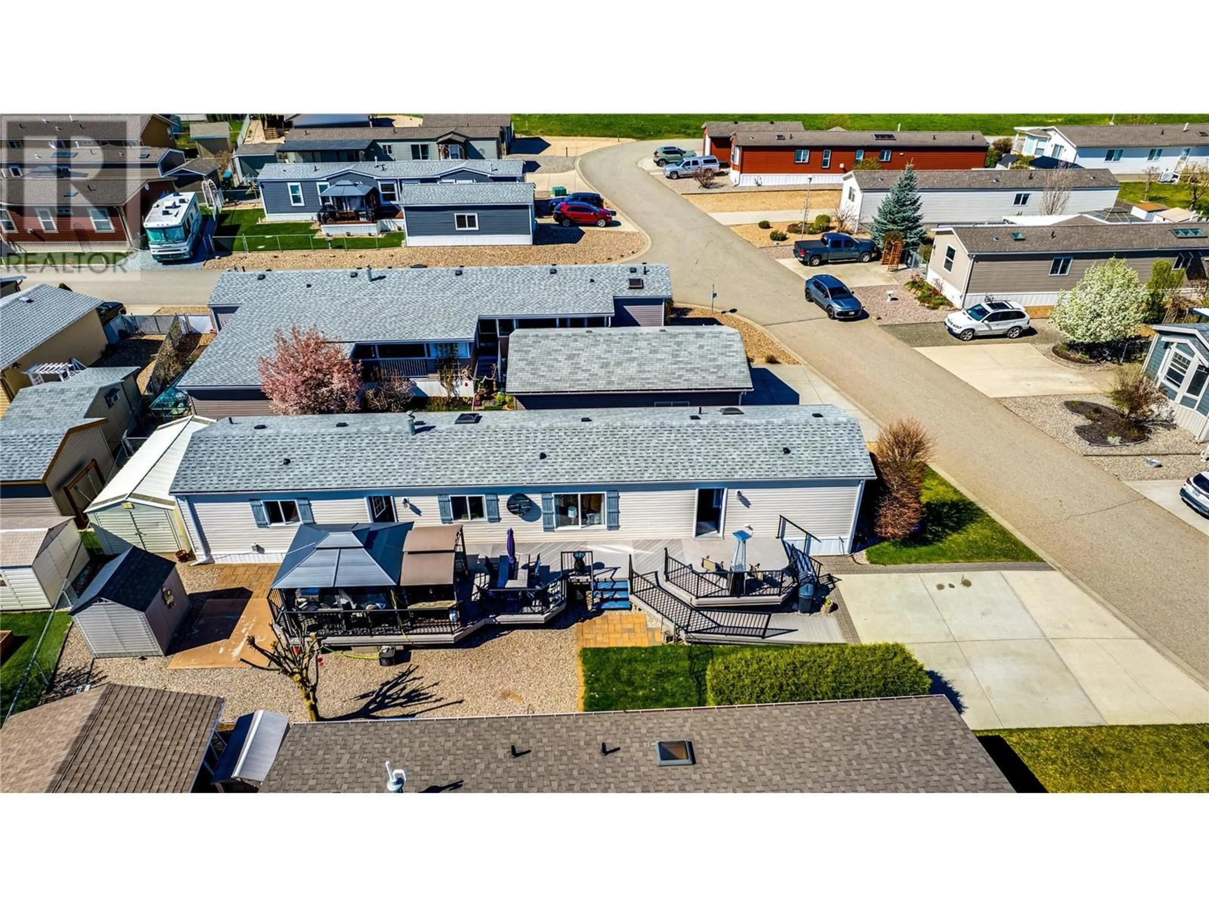 A pic from outside/outdoor area/front of a property/back of a property/a pic from drone, building for 84 - 12560 WESTSIDE ROAD, Vernon British Columbia V1H1S9
