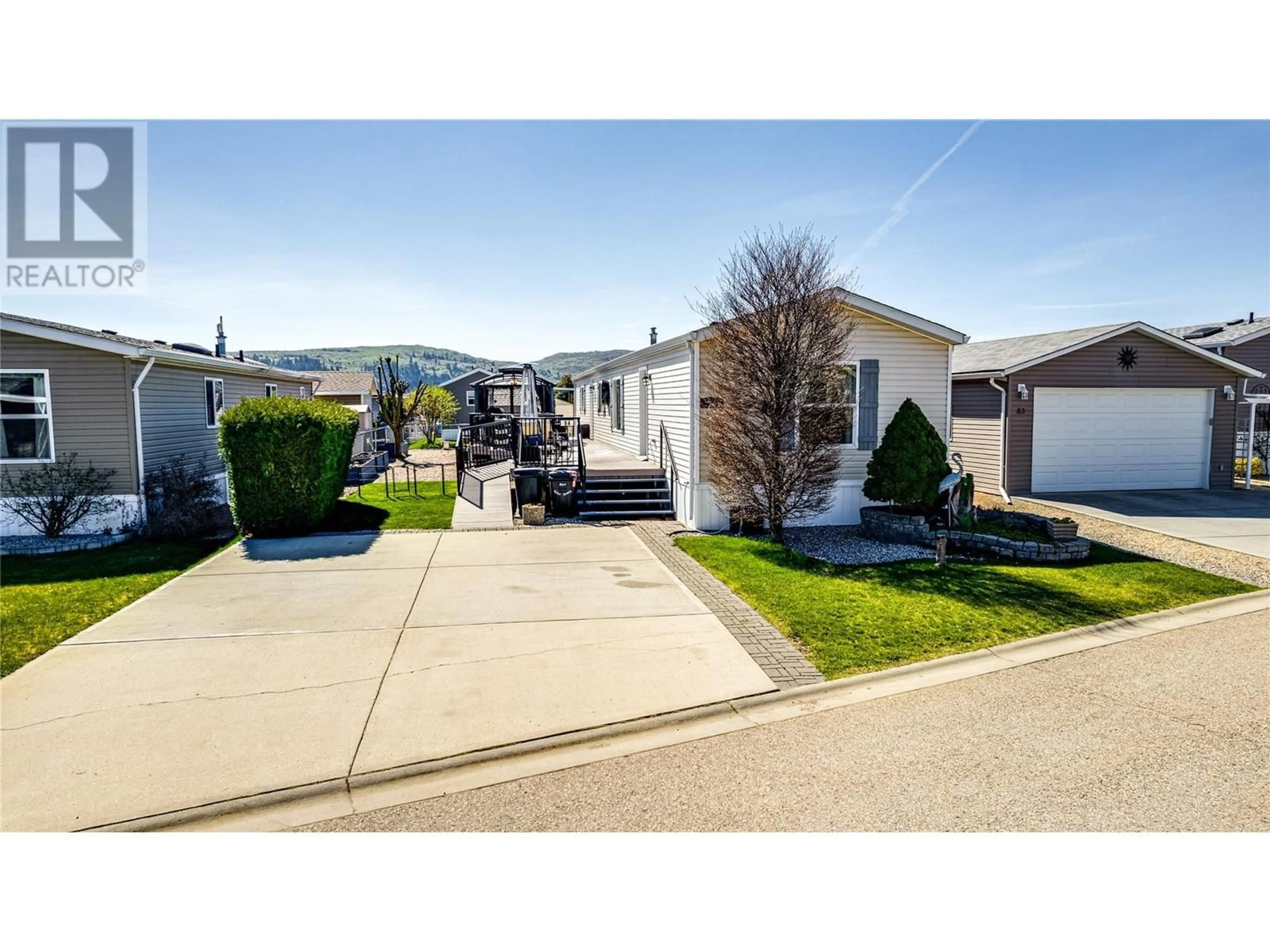 Home with vinyl exterior material, street for 84 - 12560 WESTSIDE ROAD, Vernon British Columbia V1H1S9