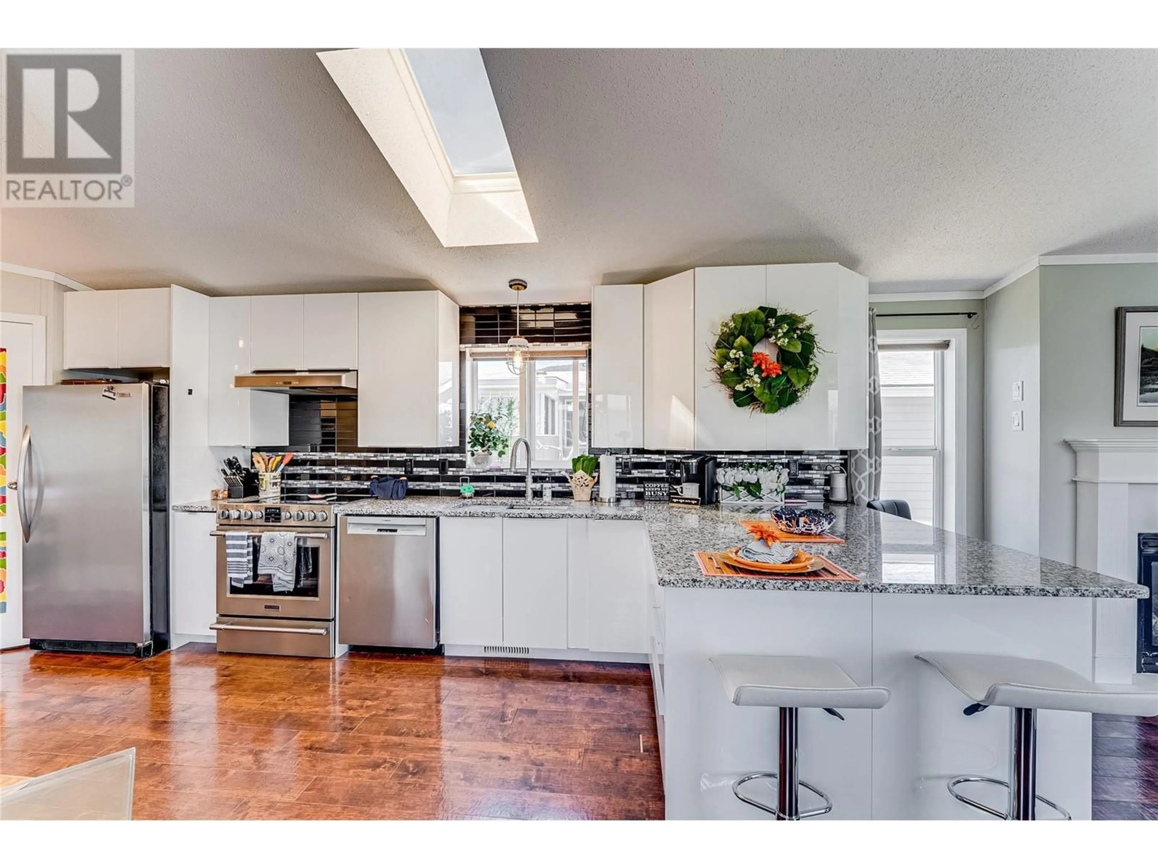 Open concept kitchen, ceramic/tile floor for 84 - 12560 WESTSIDE ROAD, Vernon British Columbia V1H1S9